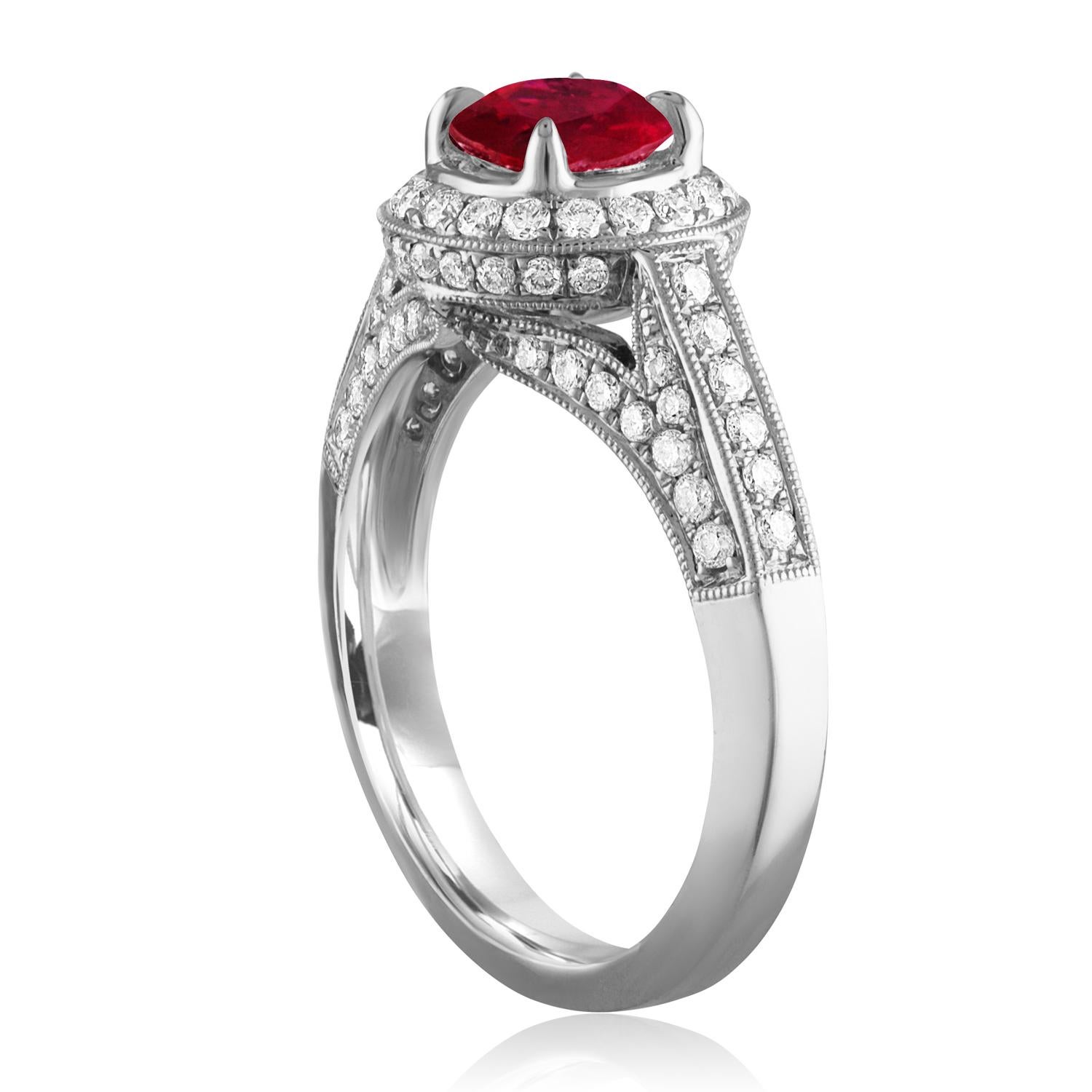 Beautiful Art Deco Revival Round Halo Milgrain Ring
The ring is 18K White Gold
The Center Stone is a Round Ruby 0.99 Carats
The Ruby is AGL Certified Heated
There are 0.64 Carats in Diamonds F/G VS/SI
The ring is a size 6.50, sizable.
The ring