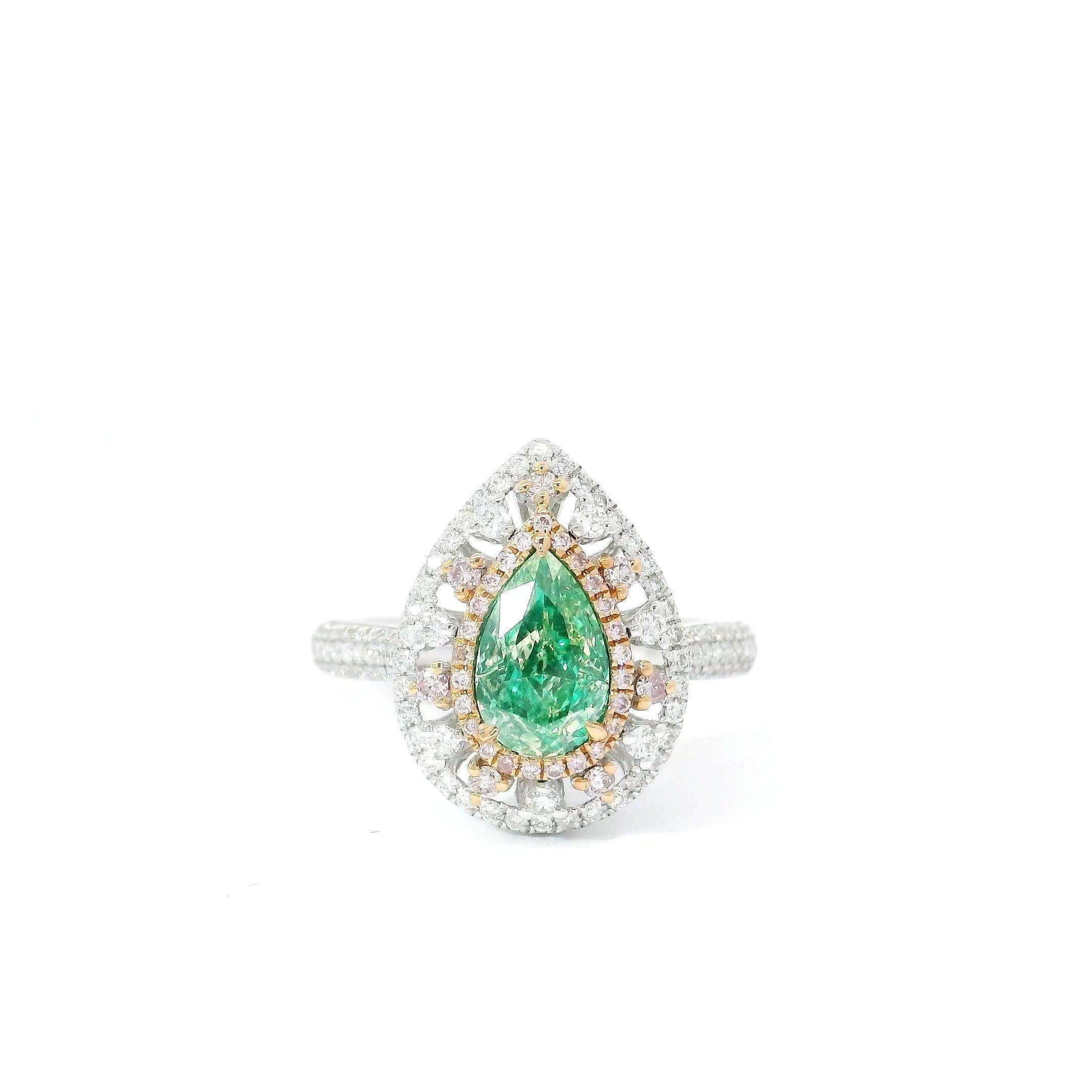 18kt white gold ring with diamonds
  
  Gold colour & karat: White gold 18kt
  Weight: 4.454 grams
  
  Set with-
  Stone type: Diamonds
  Shape: Pear
  Carat: 1.00
  Colour: Fancy Green
  Clarity: VS
  
  Surrounding Stones: Diamonds
 1) White