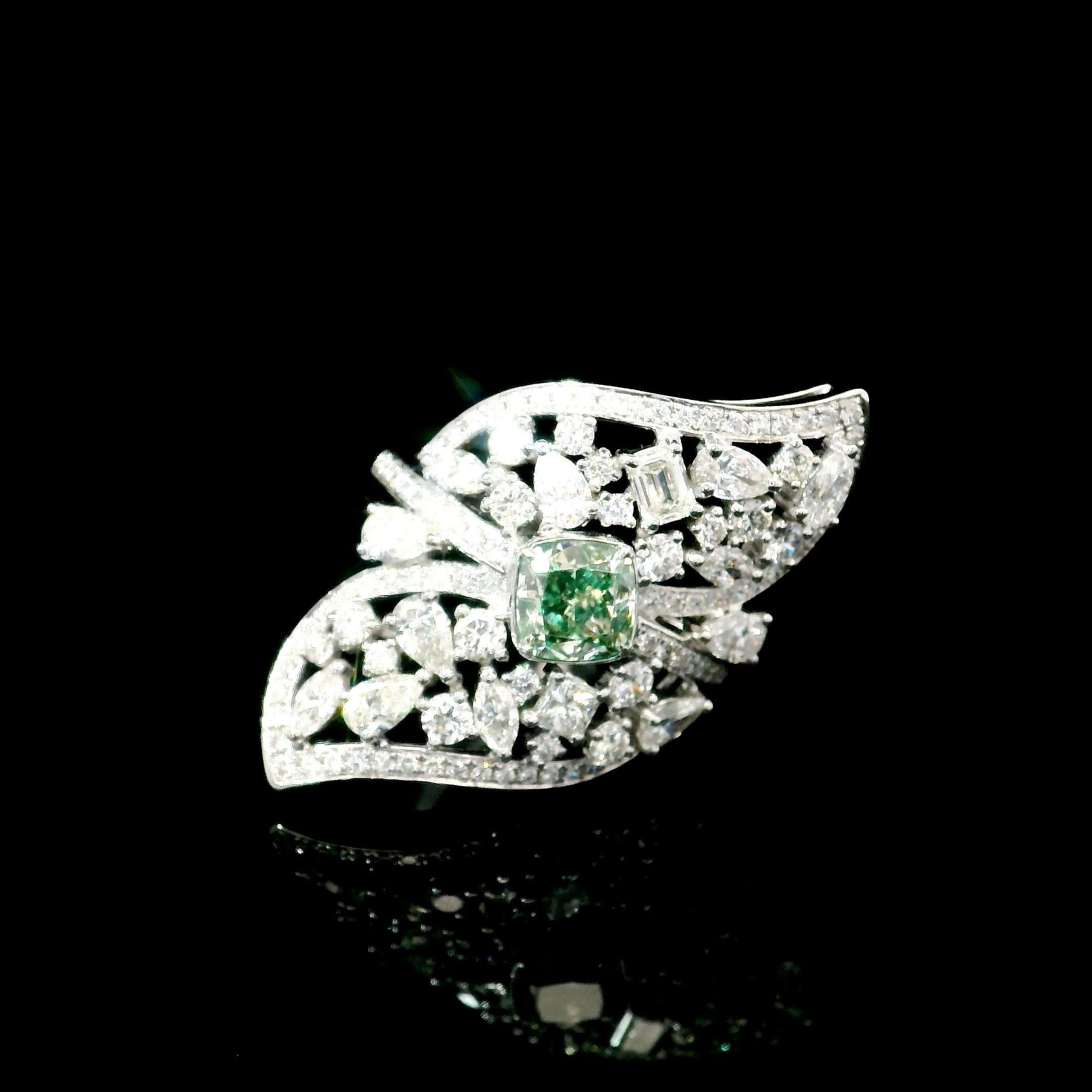 18kt white gold ring with diamonds
  
  Gold colour & karat: White gold 18kt
  Weight: 7.267 grams
  
  Set with-
  Stone type: Diamonds
  Shape: Pear
  Carat: 1.00
  Colour: Fancy Green
  Clarity: VS
  
  Surrounding Stones: Diamonds
 1) White