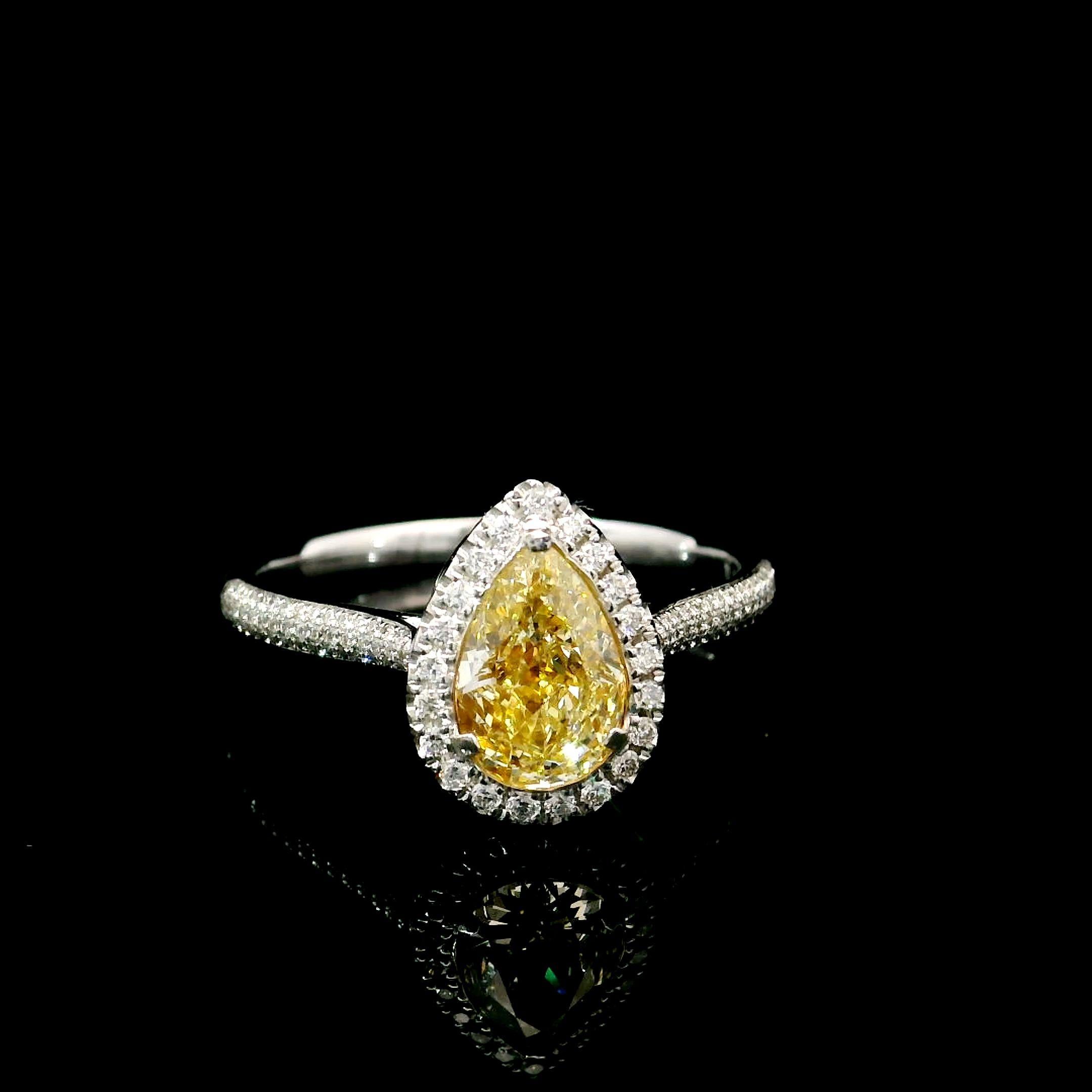 18kt white gold ring with diamonds
  
  Gold colour & Carat: White gold 18kt
  Weight: 2.997 grams
  
  Set with-
  Stone type: Diamonds
  Shape: Pear
  Carat: 1.01 ct
  Colour: Fancy Yellow
  Clarity: VS
  
  Surrounding Stones: Diamonds
 1) White