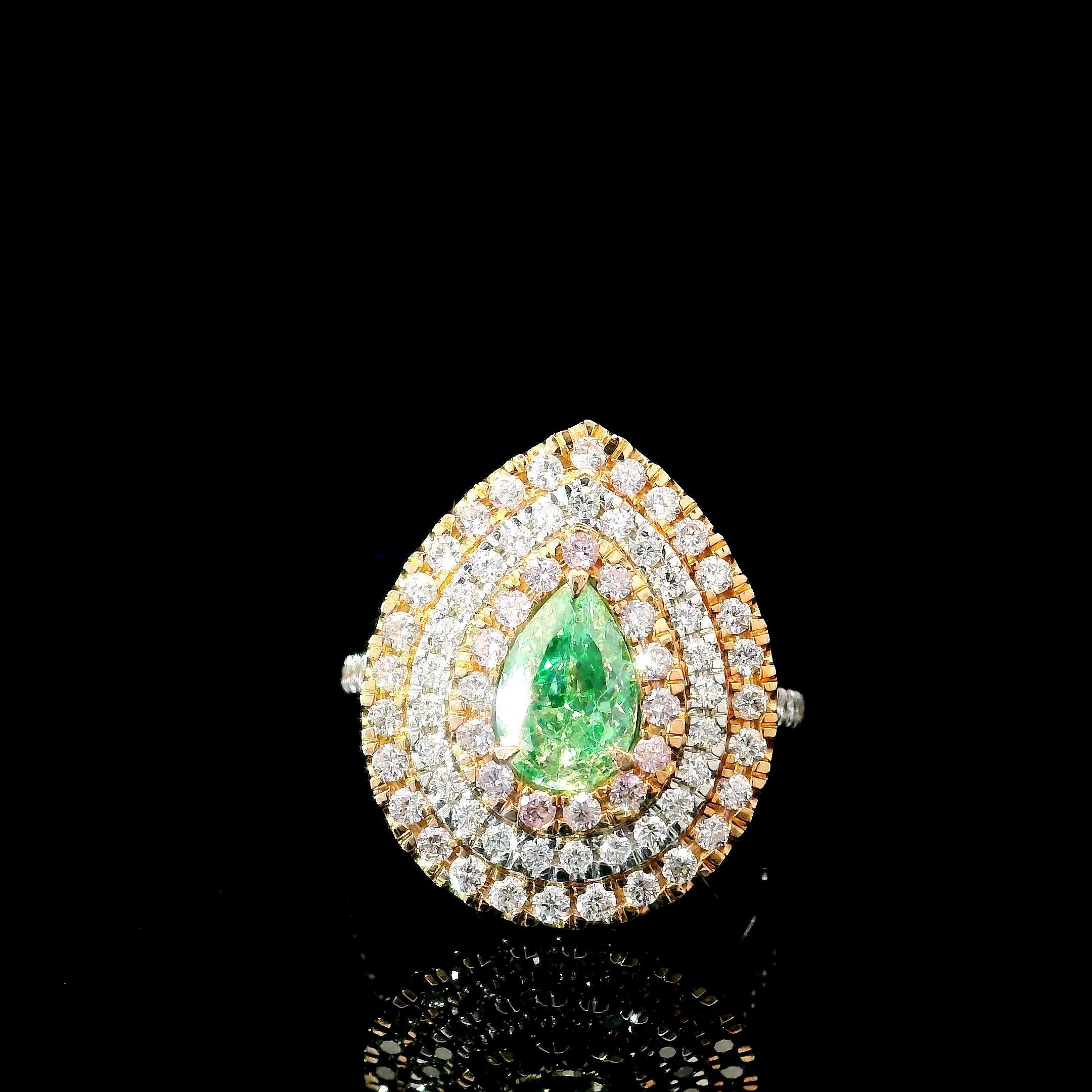 18kt white gold ring with diamonds

  Gold colour & karat: White gold 18kt
  Weight: 5.74 grams
  
  Set with-
  Stone type: Diamonds
  Shape: Pear
  Carat: 1.01 ct
  Colour: Fancy Green
  Clarity: VS
  
  Surrounding Stones: Diamonds
 1) White