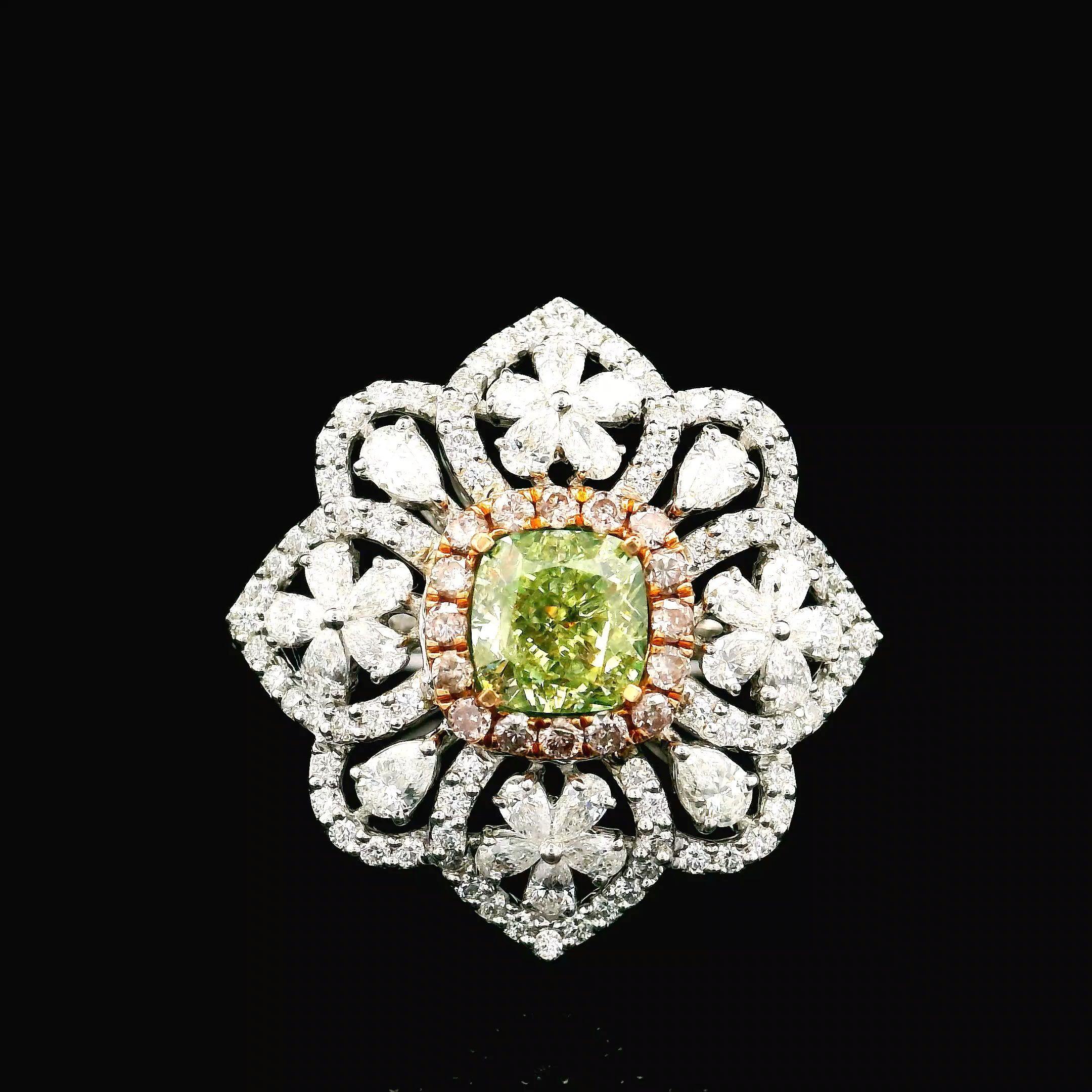 18kt white gold ring with diamonds
  
  Gold colour & Carat: White gold 18kt
  Weight: 6.38 grams
  
  Set with-
  Stone type: Diamonds
  Shape: Cushion
  Carat: 1.01 ct
  Colour: Fancy Green
  Clarity: VS
  
  Surrounding Stones: Diamonds
 1) White