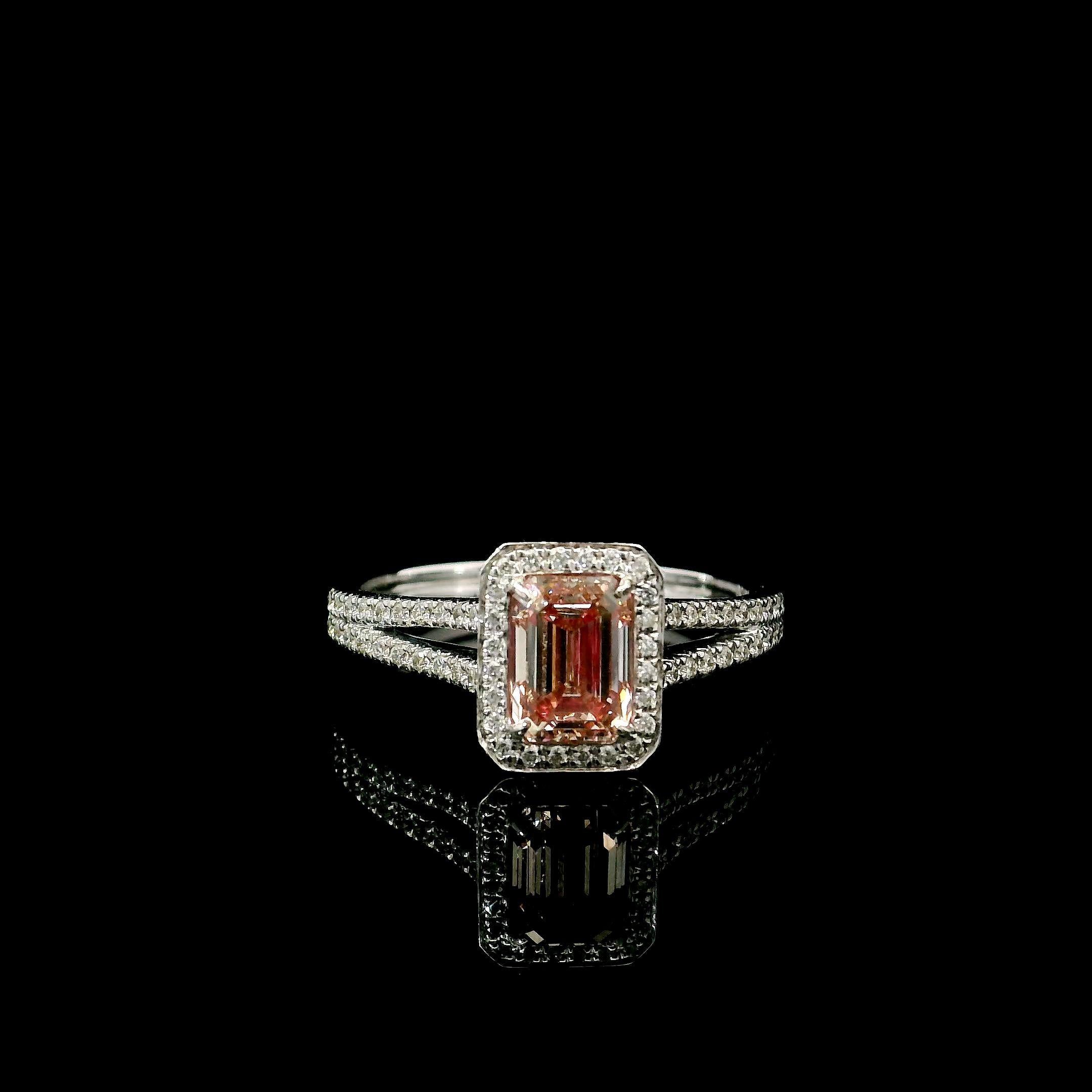18kt white gold ring with diamonds
  
  Gold colour & karat: White gold 18kt
  Weight: 3.92 grams
  
  Set with-
  Stone type: Diamonds
  Shape: Emerald
  Carat: 1.01 ct
  Colour: Fancy Pink
  Clarity: SI
  
  Surrounding Stones: Diamonds
 1) White