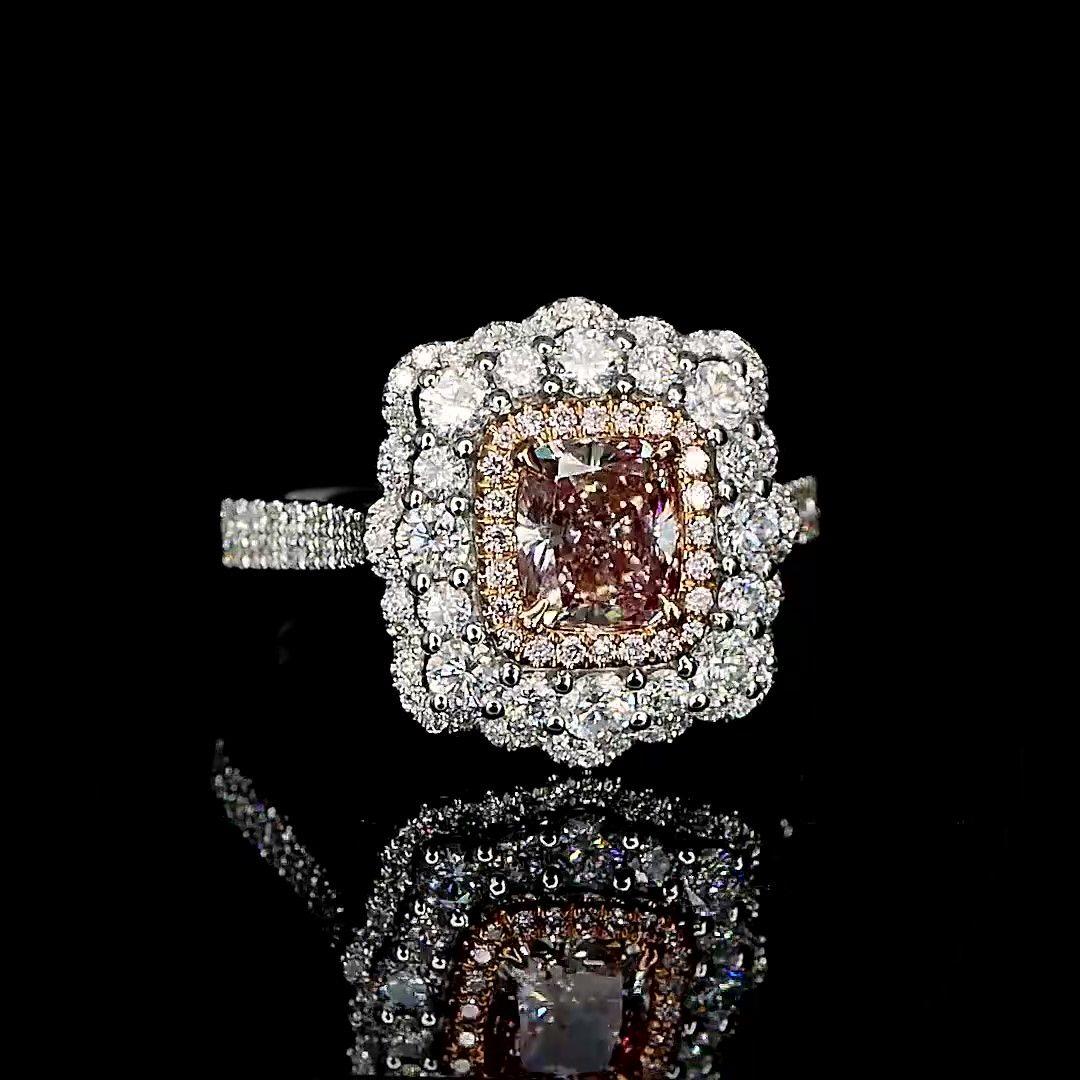18kt white gold ring with diamonds
  
  Gold colour & karat: White gold 18kt
  Weight: 5.960 grams
  
  Set with-
  Stone type: Diamonds
  Shape: Cushion
  Carat: 1.01
  Colour: Faint Pink  
  Clarity: VS
  
  Surrounding Stones: Diamonds
 1) White