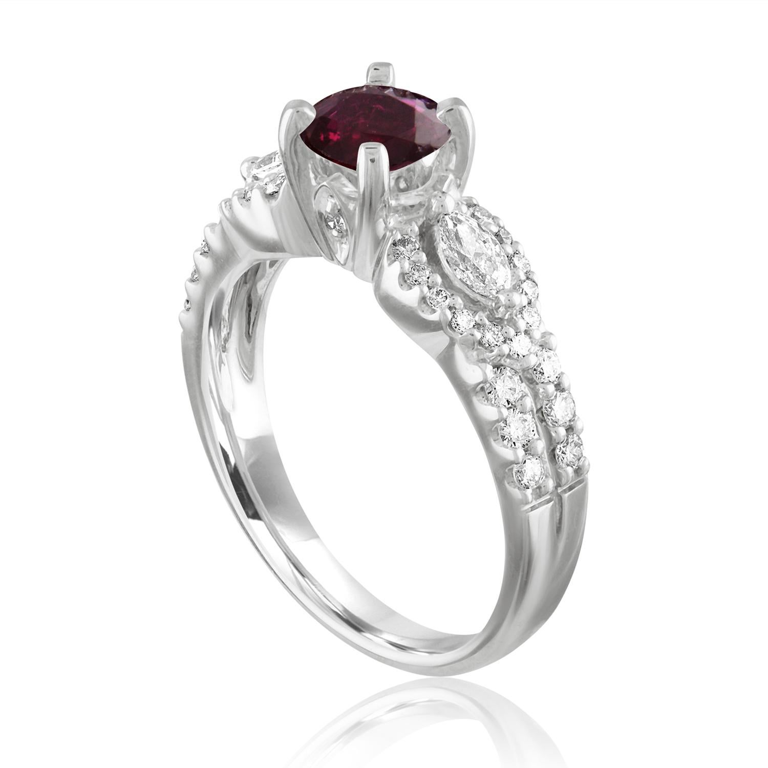 Beautiful Round Halo Split Shank Ring
The ring is 18K White Gold
The Center Stone is a Round Ruby 1.02 Carats
The Ruby is AGL Certified Heated
There are 0.50 Carats in Diamonds F/G VS/SI
The ring is a size 6.5, sizable.
The ring weighs 5.4 grams