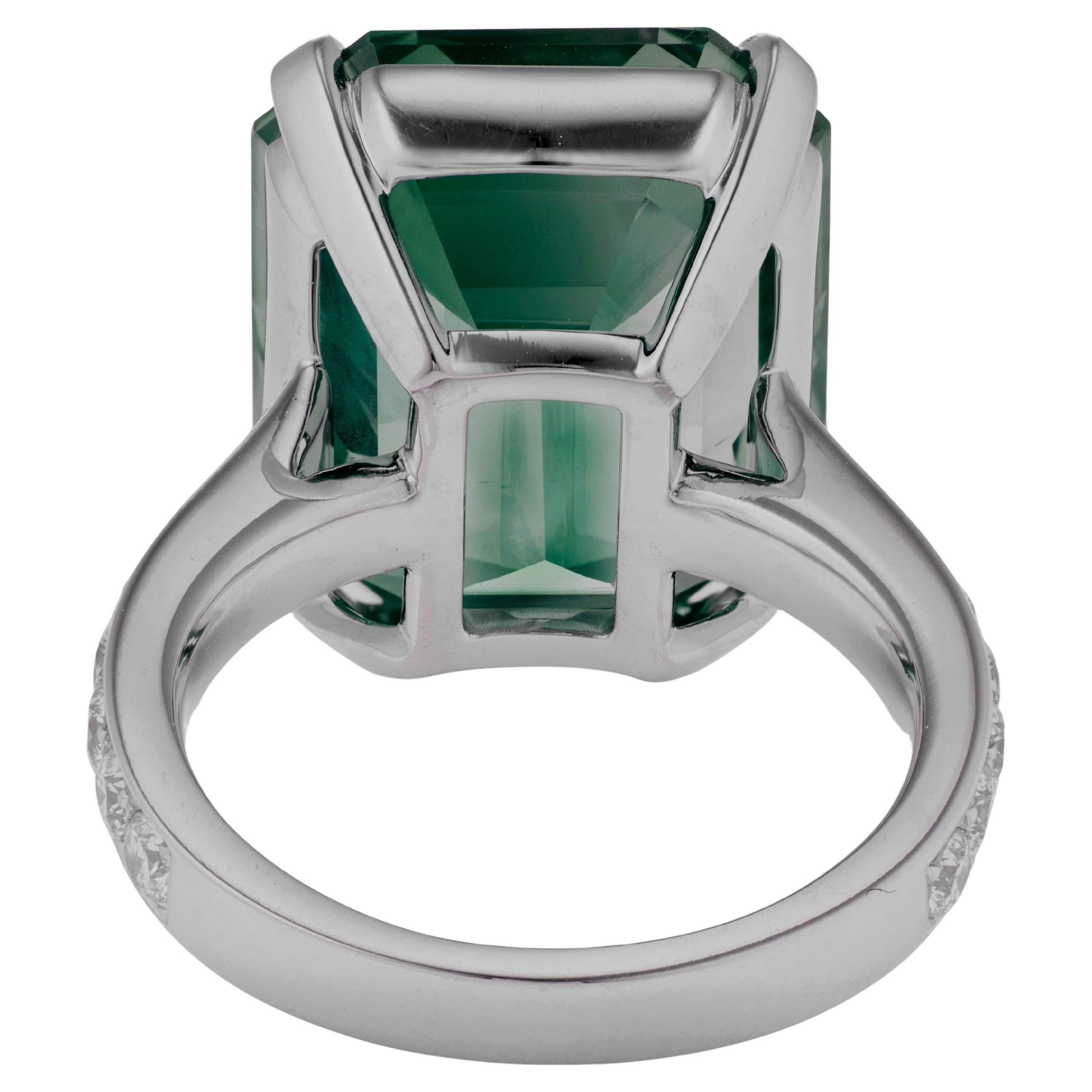 Exquisite 10.23 Carat Zambian Emerald and Diamond Platinum Ring

This stunning high-jewelry creation features a rare and vividly saturated emerald-cut emerald from Zambia, certified by AGL Weighing an impressive 10.23 carats, the emerald captivates
