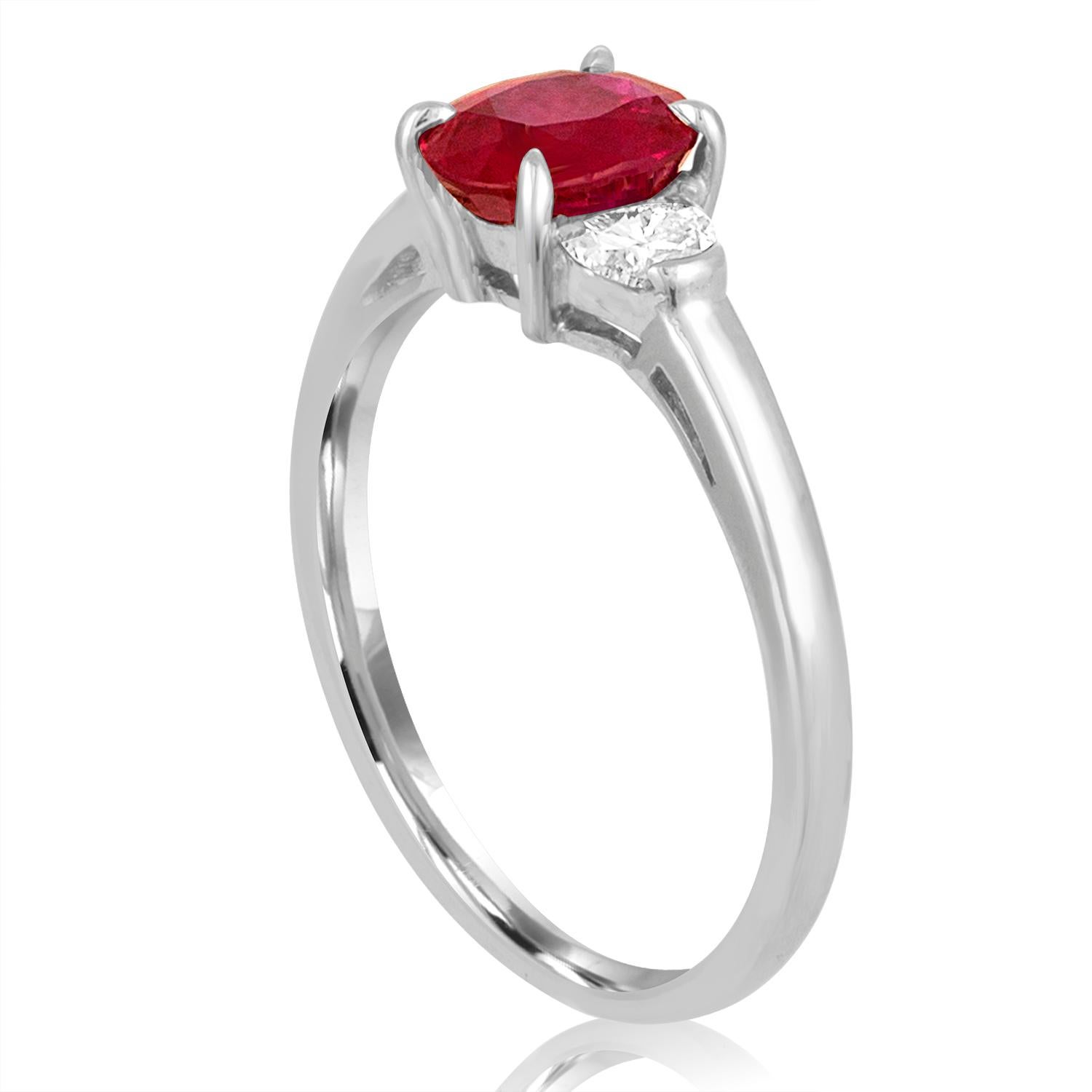 The ring is 18K White Gold
The Diamonds are Half Moons Total 0.30 Carats G VS
The center stone is an Oval Ruby, AGL Certified
The ruby is 1.04 Carats Heated
The ring is a size 6.25, sizable.
The ring weighs 2.6 grams