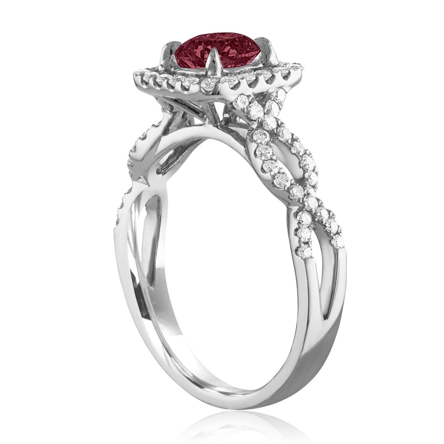 Beautiful Square Halo with Criss Cross Shank Ring
The ring is 18K White Gold
The Center Stone is a Round Ruby 1.04 Carats
The Ruby is AGL Certified Heated
There are 0.44 Carats in Diamonds F/G VS/SI
The ring is a size 6.5, sizable.
The ring weighs