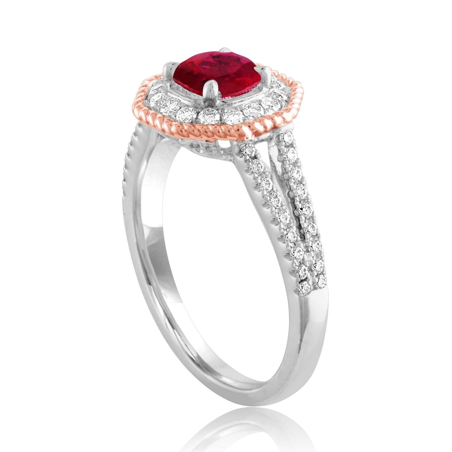 Beautiful Octagon Halo Two Tone Ring
The ring is 18K White & Rose Gold
The Center Stone is a Round Ruby 1.05 Carats
The Ruby is AGL Certified Heated
There are 0.68 Carats in Diamonds F/G VS/SI
The ring is a size 6.5, sizable.
The ring weighs 4.7