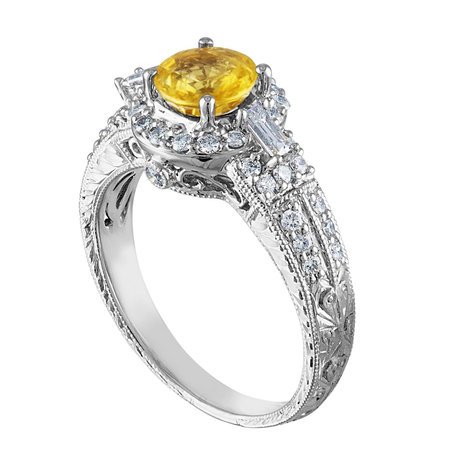 Beautiful Art Deco Revival Round Halo Milgrain Filigree Ring
The ring is 18K White Gold
The Center Stone is a Round Yellow Sapphire 1.05 Carats
The Sapphire is AGL Certified Heated
There are 0.45 Carats in Diamonds F/G VS/SI
The ring is a size 5.50,