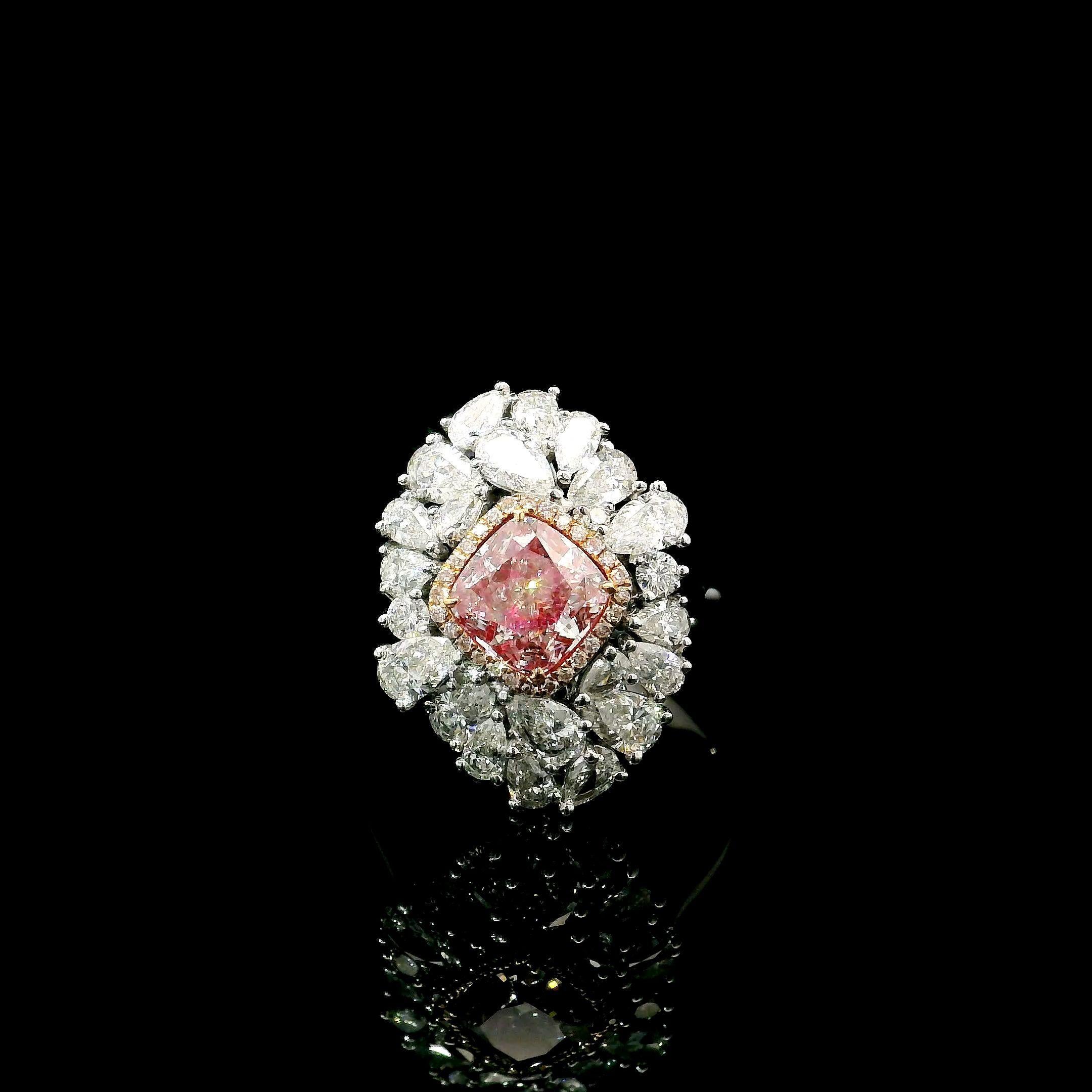 18kt white gold ring with diamonds
  
  Gold colour & karat: White gold 18kt
  Weight: 5.812 grams
  
  Set with-
  Stone type: Diamonds
  Shape: Cushion
  Carat: 1.15 ct
  Colour: Light Pinkish Brown
  Clarity: SI1
  
  Surrounding Stones: