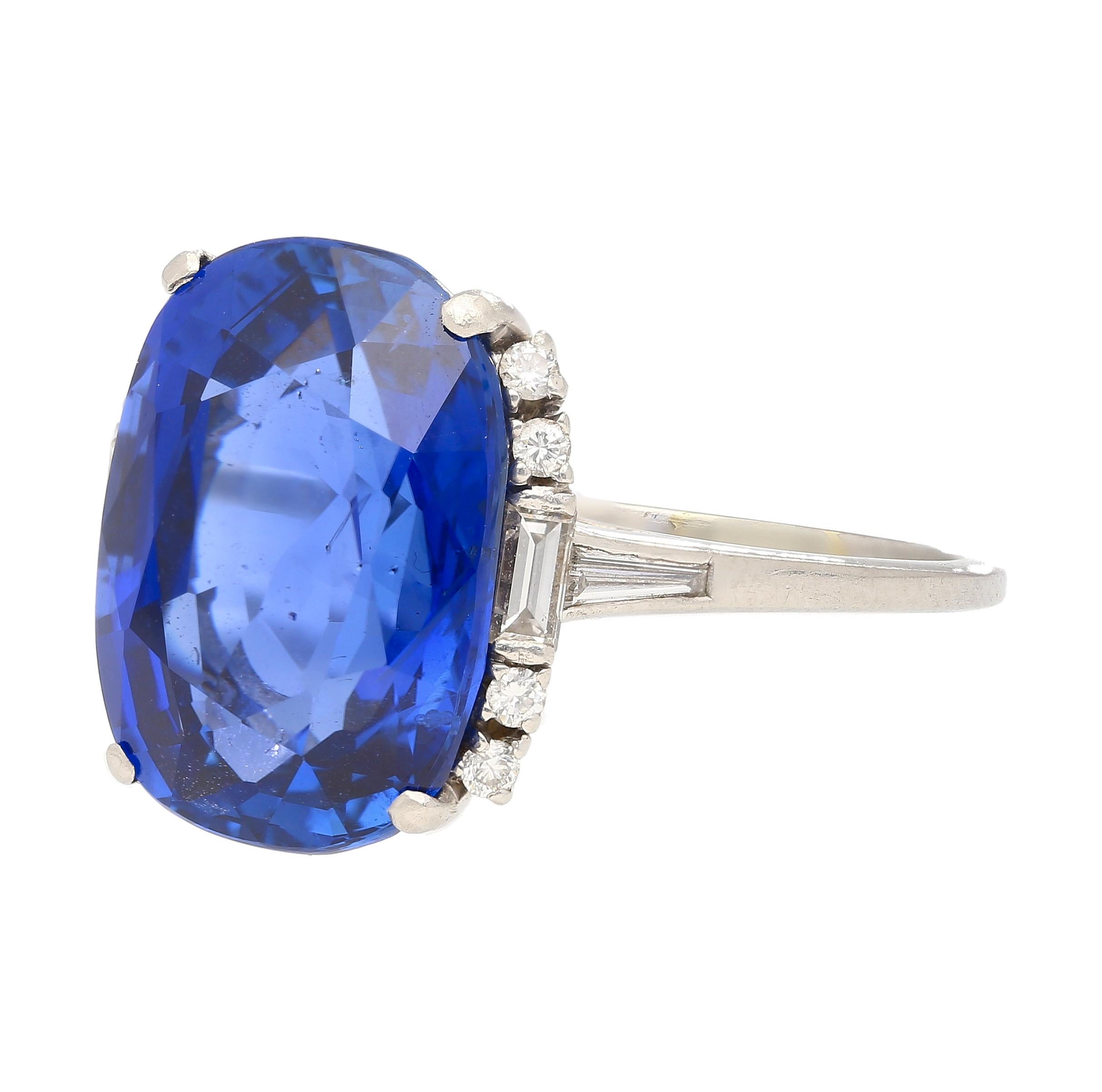 Centering an 11.63 Carat Royal Blue Burma (Myanmar) Sapphire, accented by Round-Brilliant Cut Diamonds, and set in Platinum, this treasure exemplifies the quality and craftsmanship of the famed Art Deco Era.

The center stone is a true miracle of