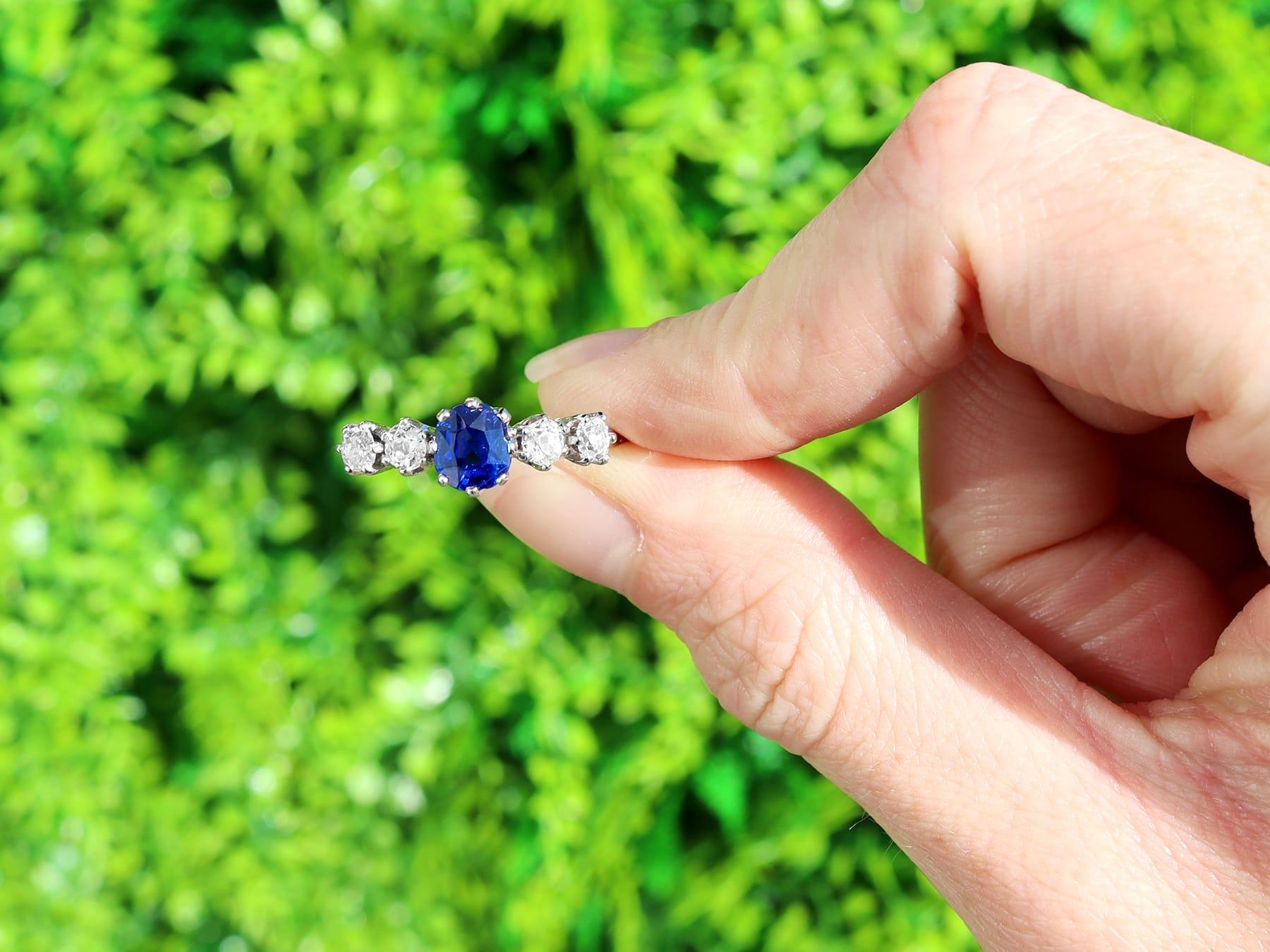 A stunning, fine and impressive antique 1.19 carat blue sapphire and 0.84 carat diamond, contemporary 18 karat white gold five stone ring; an addition to our diamond and gemstone jewellery and estate jewelry collections.

This stunning sapphire and