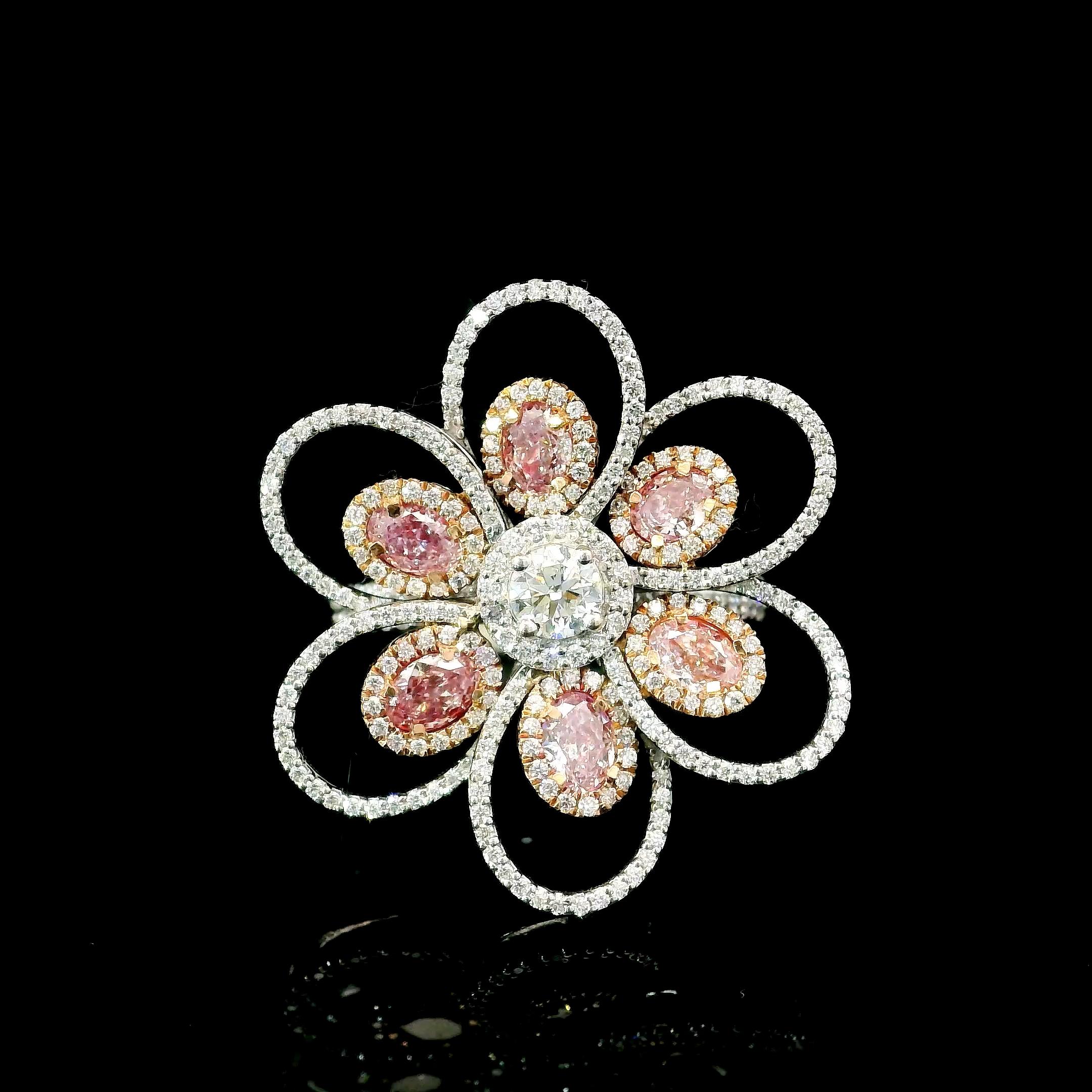 18kt white gold ring with diamonds
  
  Gold colour & karat: White gold 18kt
  Weight: 7.149 grams
  
  Set with-
  Stone type: Diamonds
  Shape: Ovel
  Carat: 1.20 ct (06 pcs)
  Colour: Fancy Pink
  Clarity: VS

  Surrounding Stones: Diamonds
 1)