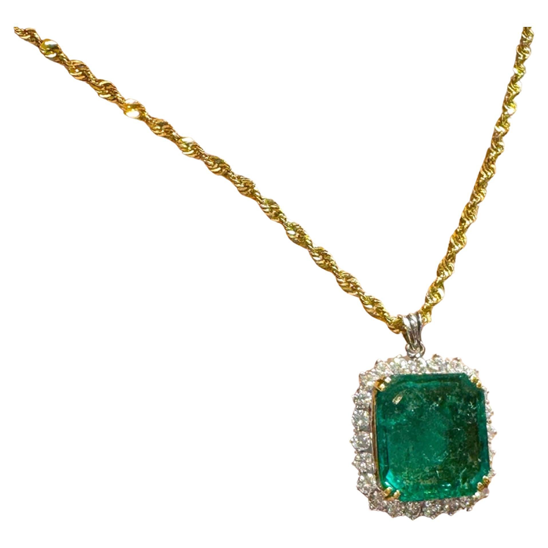 Discover the mesmerizing allure of this stunning pendant necklace. At its heart lies a breathtaking 43carat minor oil ZAMBIAN Emerald, masterfully square-cut to showcase its vivid green color, exceptional luster, and remarkable transparency, all