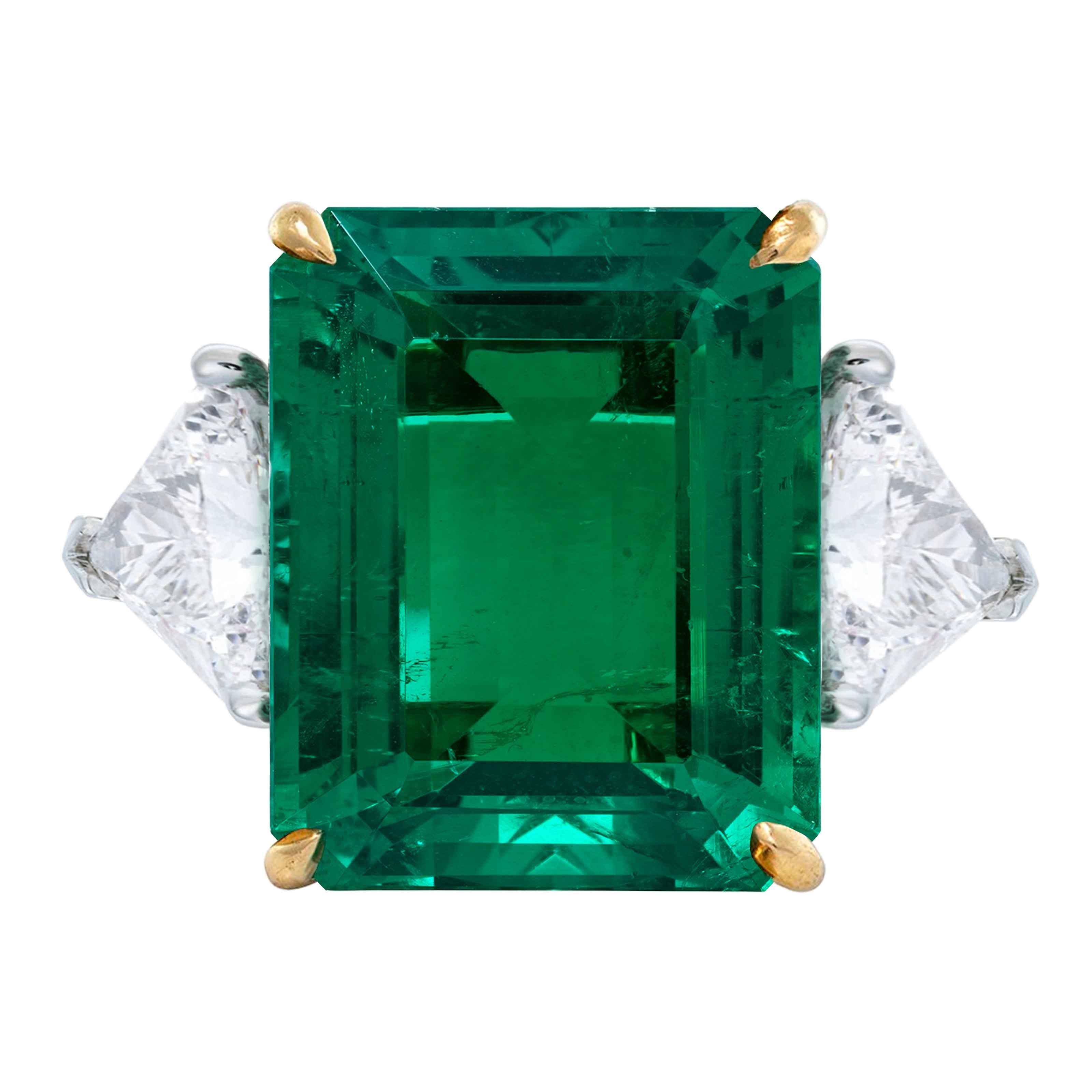  AGL Certified 13 Carat Green Emerald Trillion Side Diamond Ring:

Experience the epitome of luxury with our AGL Certified 13 Carat Green Emerald Trillion Side Diamond Ring. This magnificent ring features a breathtaking 13 carat green emerald,