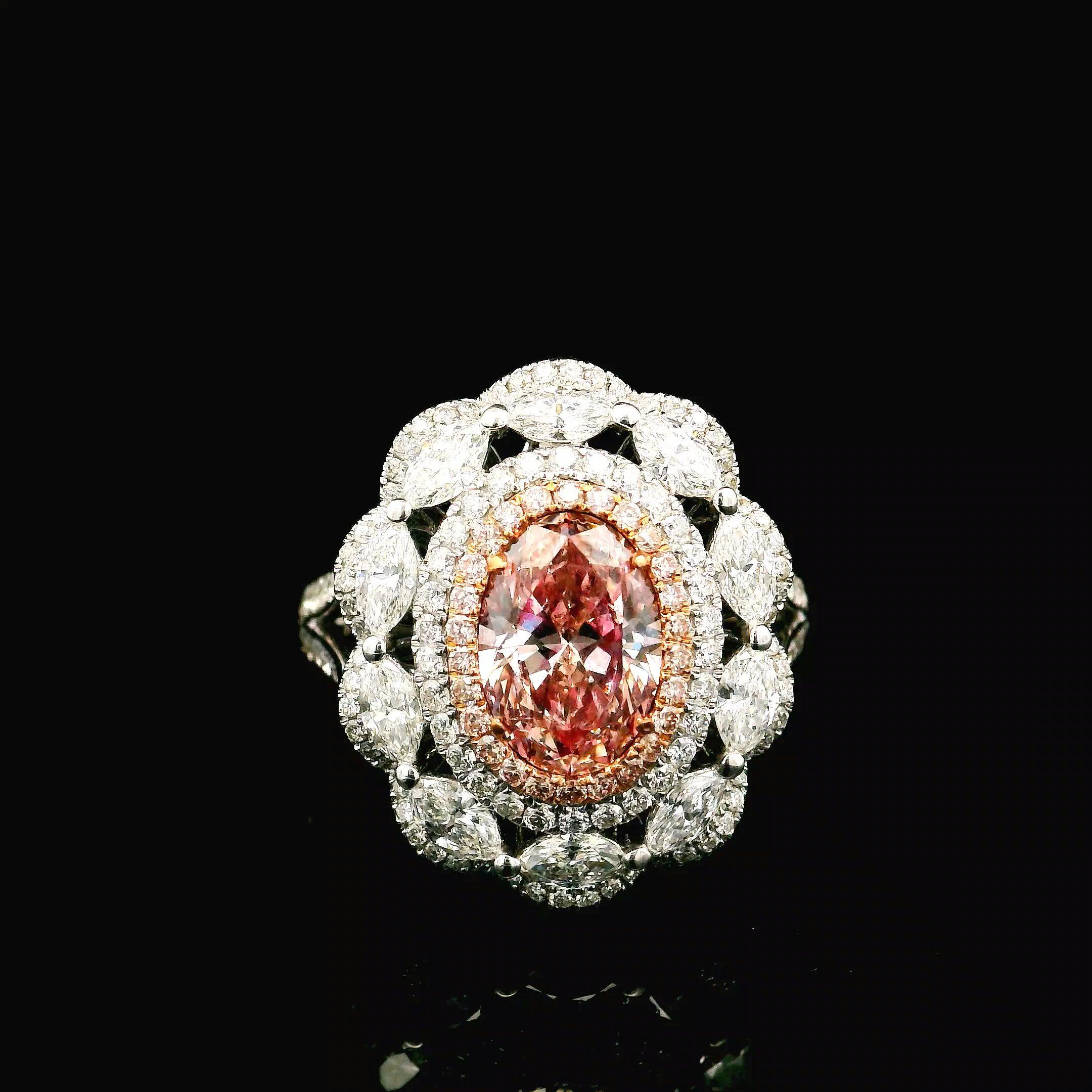 18kt white gold ring with diamonds
  
  Gold colour & Carat: White gold 18kt
  Weight: 7.96 grams
  
  Set with-
  Stone type: Diamonds
  Shape: Oval
  Carat: 1.31 ct
  Colour: Fancy Pink
  Clarity: VS
  
  Surrounding Stones: Diamonds
 1) White