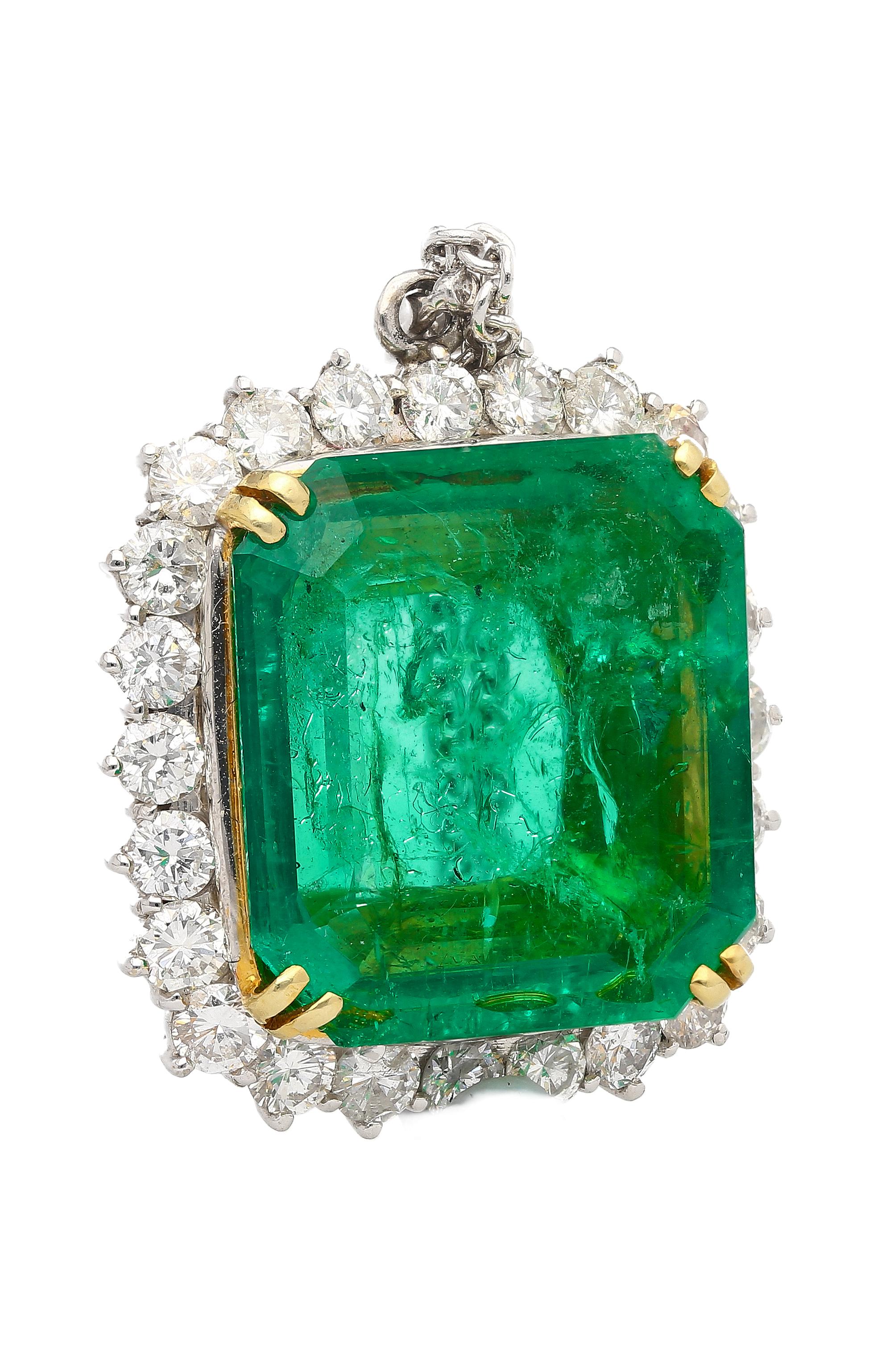 Prepare to be enchanted by the radiance and luster of this pendant necklace. Taking center stage is a 13.49 carat minor oil Colombian Emerald. Square emerald cut with vivid green color, excellent luster, and transparency. Certified by AGL