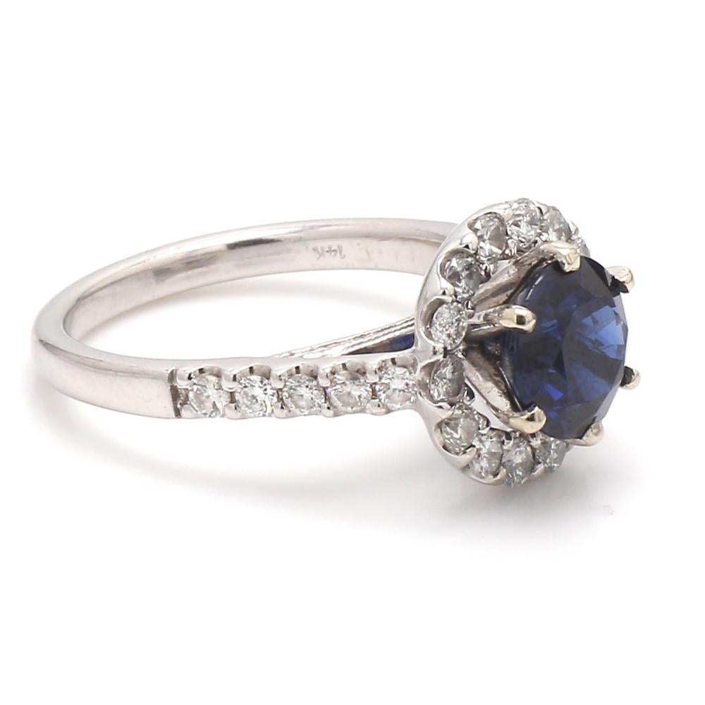 14K white gold, sapphire ring.  Center stone is one (1) round brilliant cut, Thai sapphire weighing 2.16ct. Sapphire is accompanied by AGL Prestige Gemstone Report #1092325. Ring is set with thirty-two (32) round brilliant cut diamonds weighing