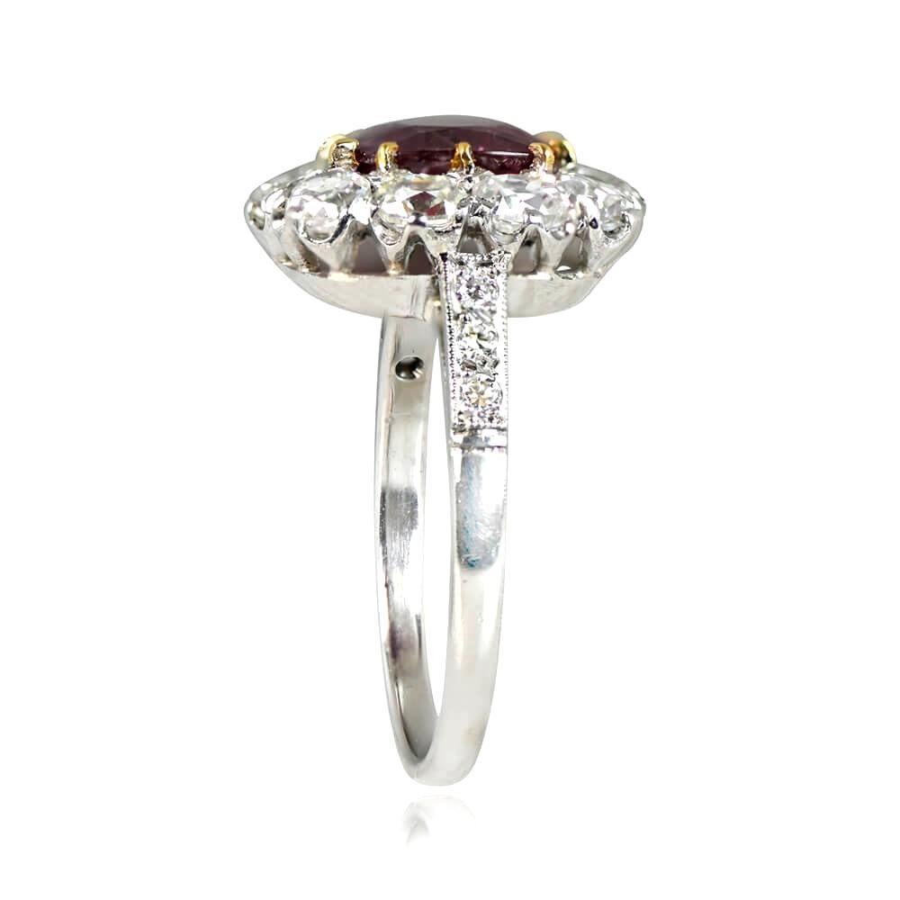 Handcrafted with utmost care, this ring boasts a 1.46-carat cushion cut natural non-heated Burma ruby set in 18k yellow gold prongs. The center stone is certified by AGL and surrounded by a halo of old mine cut diamonds, with additional old European