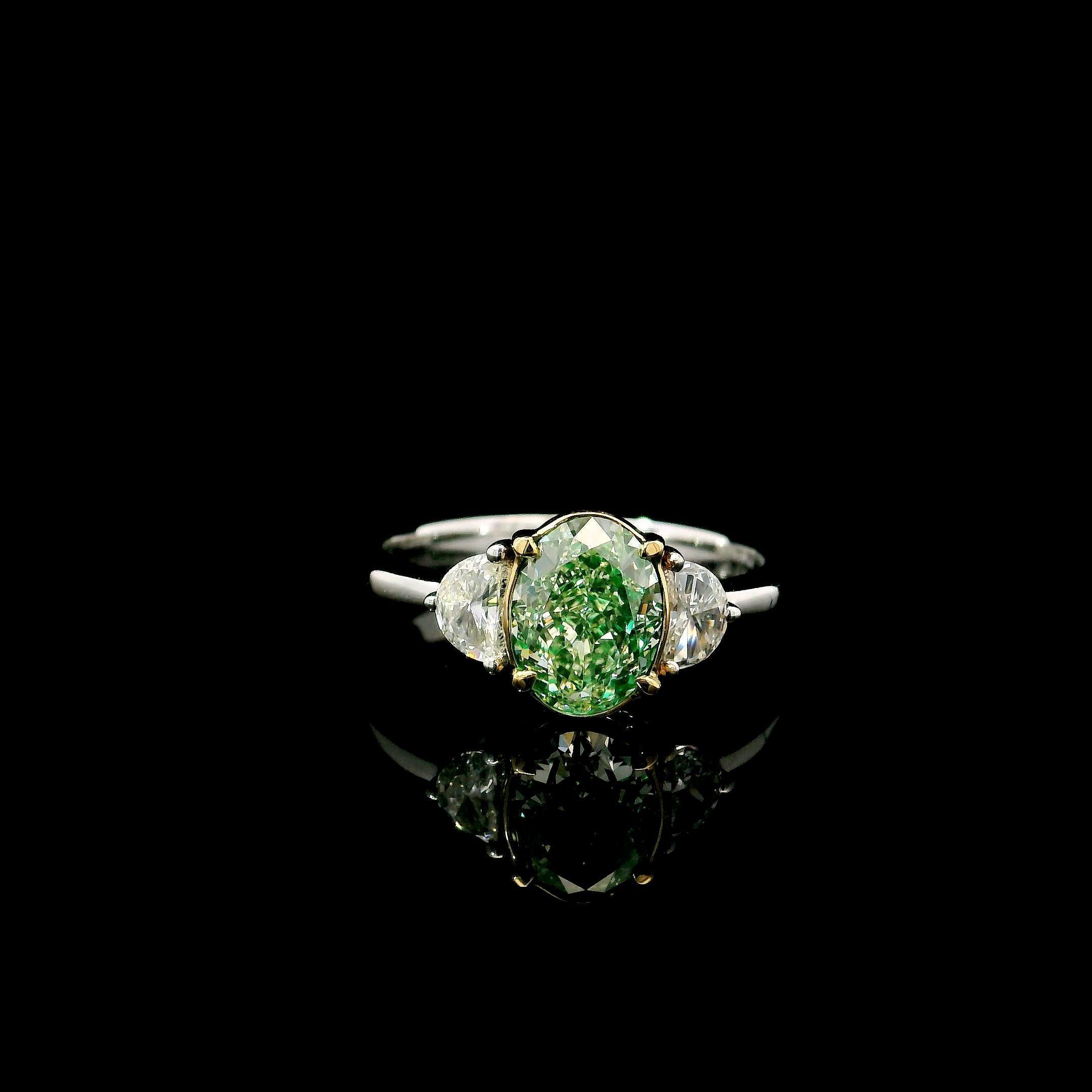 18kt white gold ring with diamonds
  
  Gold colour & karat: White gold 18kt
  Weight: 3.598 grams
  
  Set with-
  Stone type: Diamonds
  Shape: Oval
  Carat: 1.51
  Colour: Fancy Light Green
  Clarity: VS
  
  Surrounding Stones: Diamonds
 1) Side