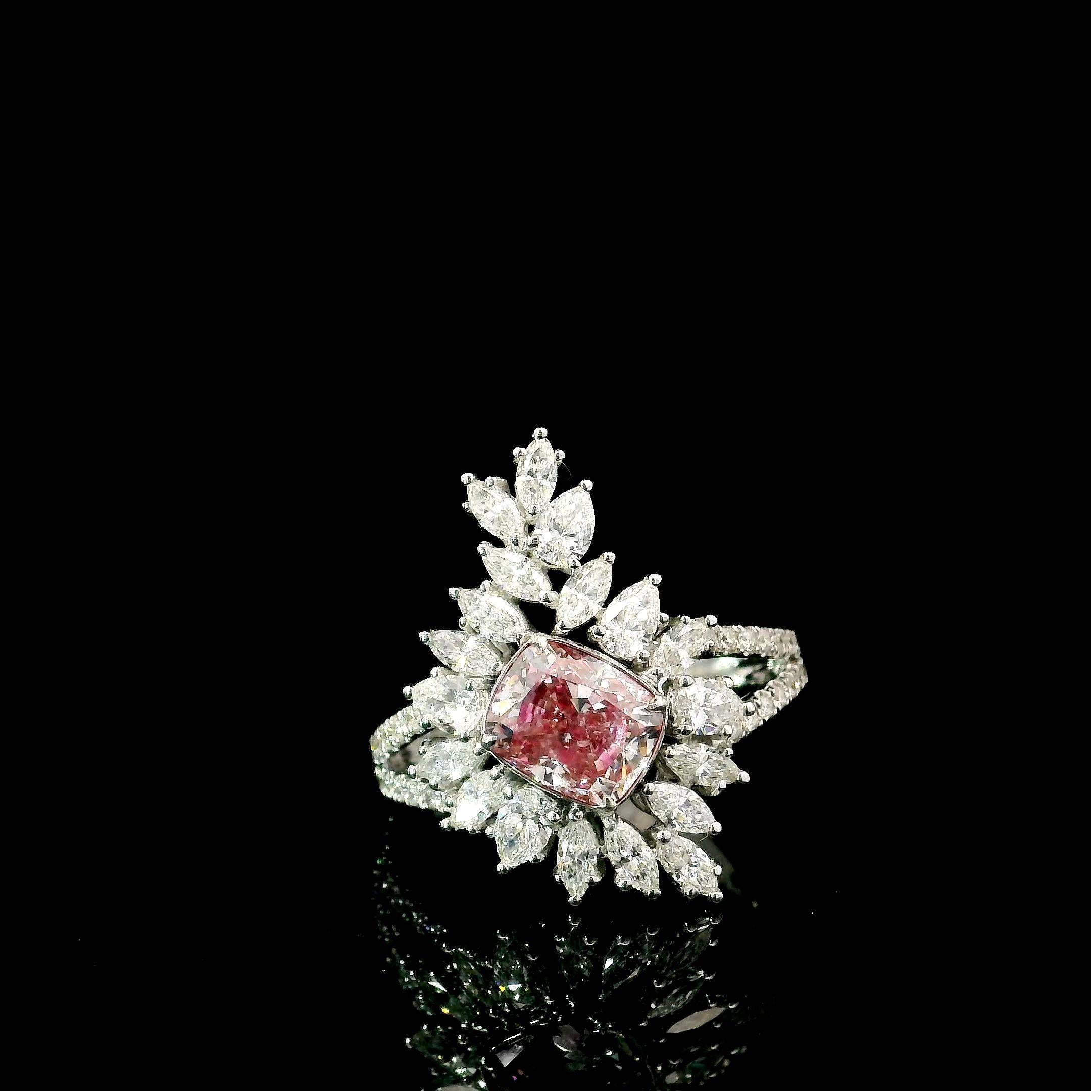 18kt white gold ring with diamonds
  
  Gold colour & karat: White gold 18kt
  Weight: 5.81 grams
  
  Set with-
  Stone type: Diamonds
  Shape: Cushion
  Carat: 1.51 ct
  Colour: Fancy Pink
  Clarity: SI1
  
  Surrounding Stones: Diamonds
 1) Side