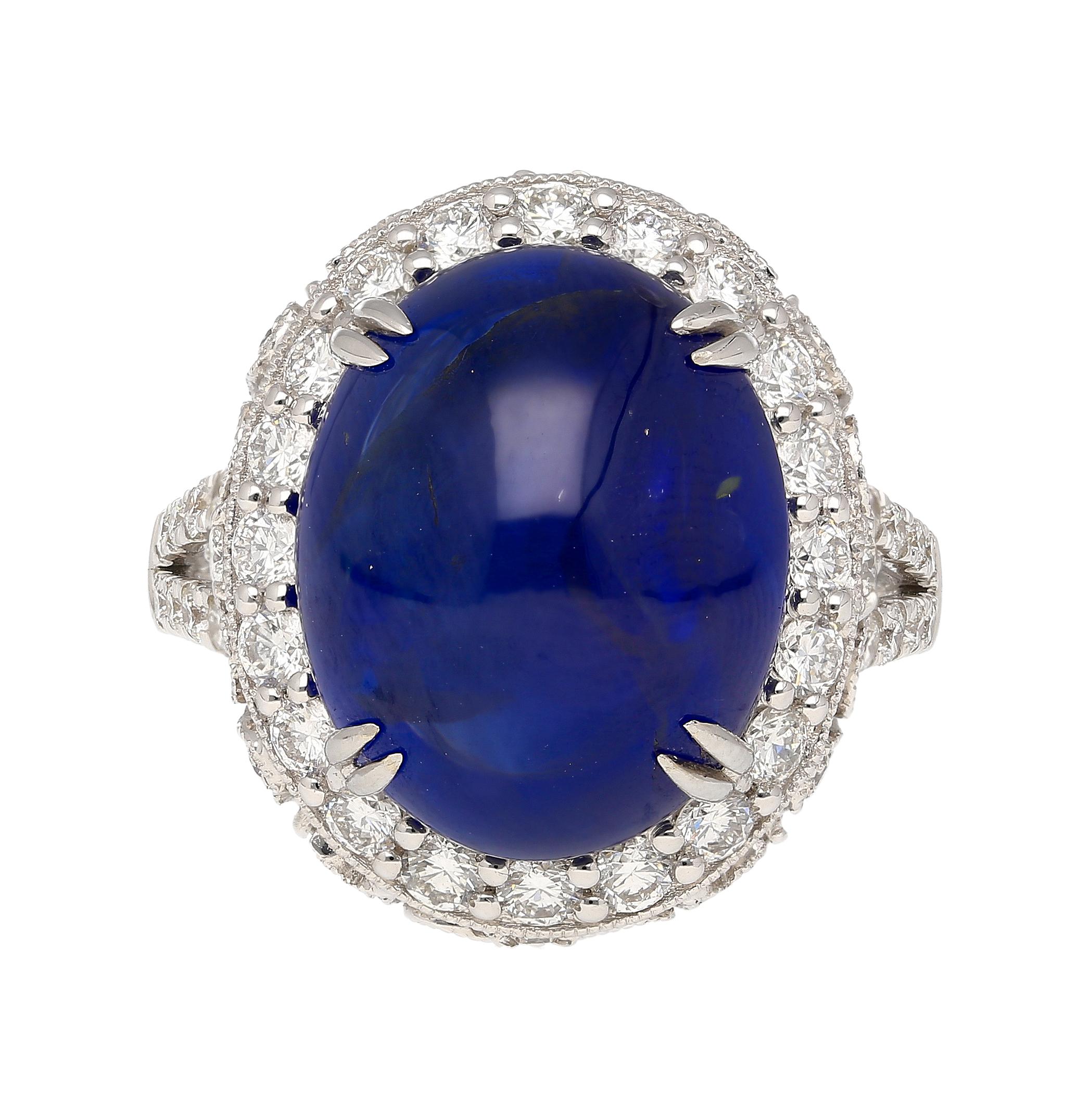 AGL certified 16.68 carat oval cut natural Ceylon origin Blue Sapphire and Diamond ring. Crafted in 18K white gold, this extraordinary piece showcases a captivating cabochon cut of exceptional quality and beauty. Adorned with a dazzling 1.32 carats