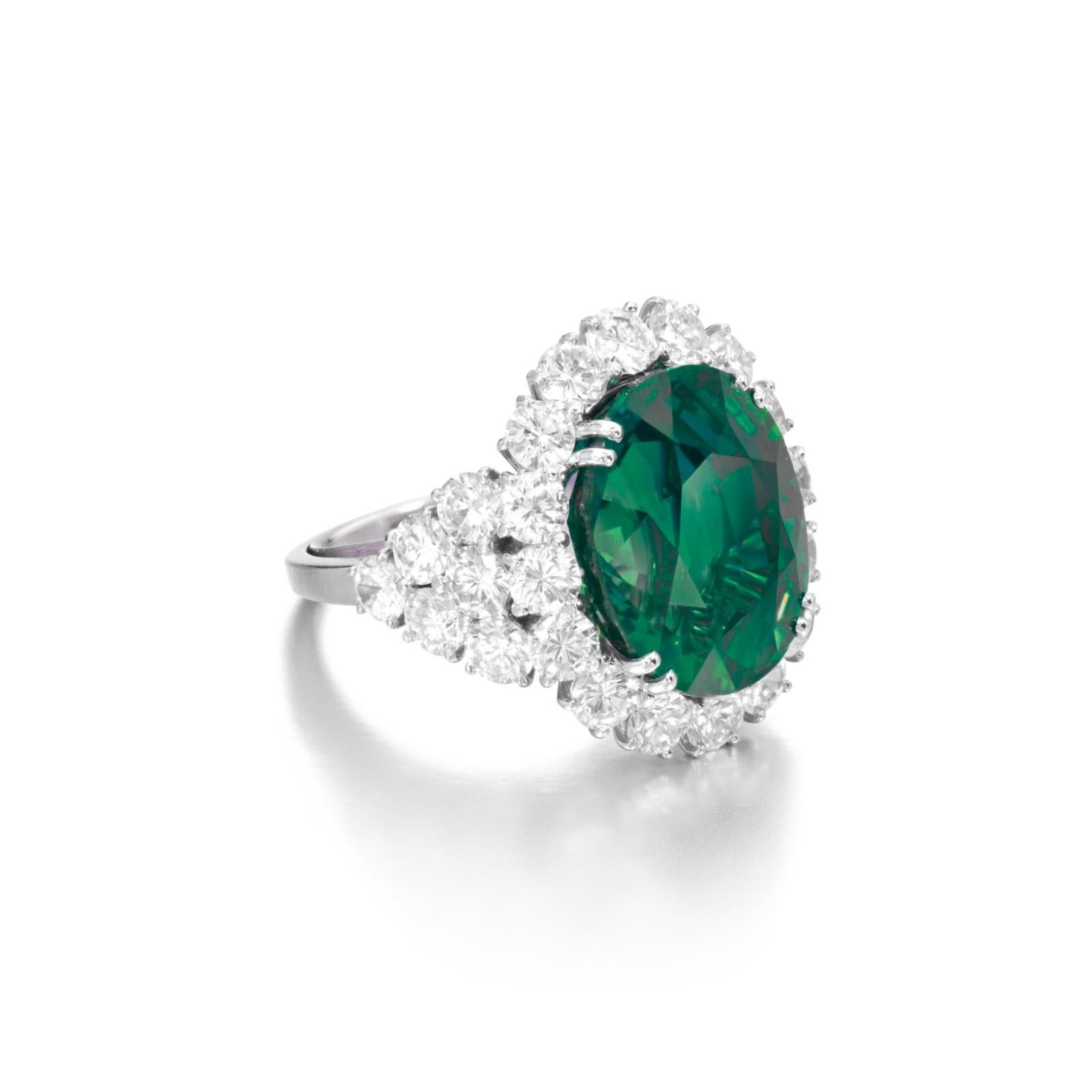 Centering an oval-shaped emerald of 16.94 carats, flanked by round shaped diamonds 

emerald weighing 16.94 carats
Size 6
Platinum
Accompanied by AGL report