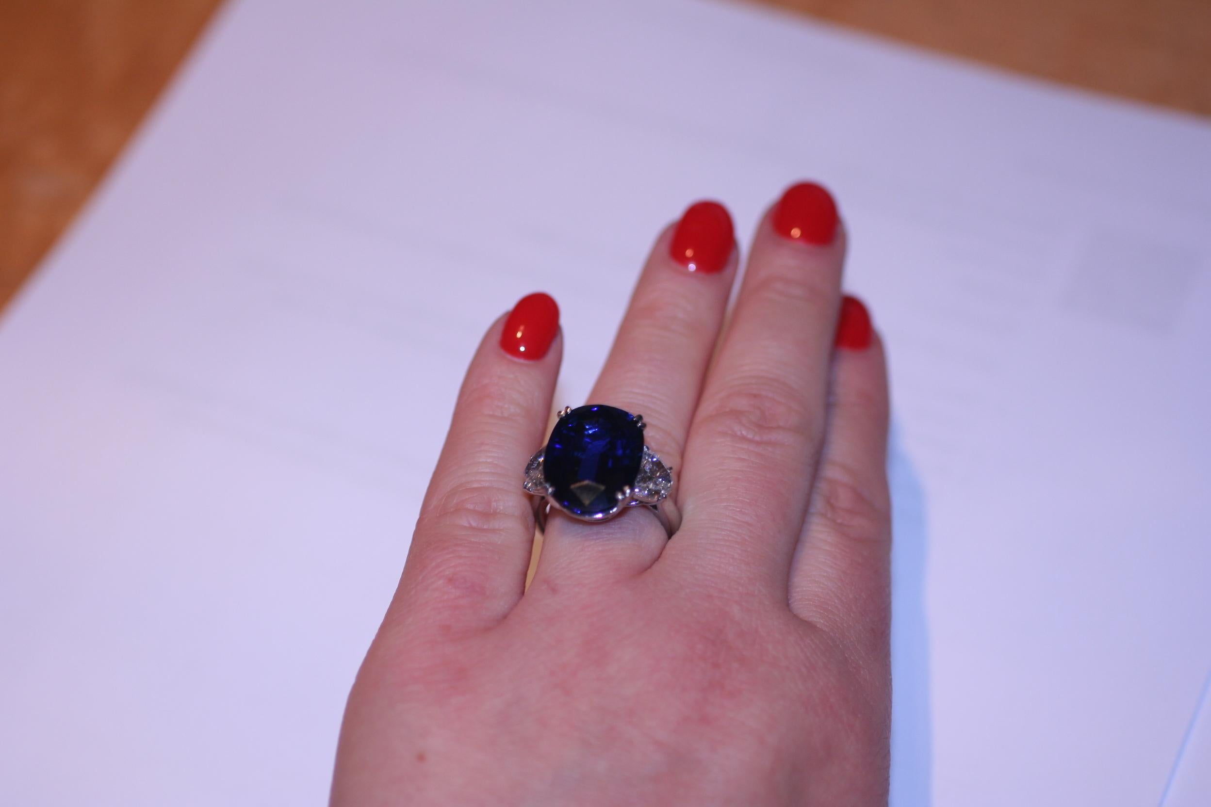 Certified Oval Blue Sapphire weighing 16.99 carats, set in a Handmade Platinum Ring with 2 Half Moon Shaped Diamonds F color VS clarity weighing 1.96 carats. 

AGL#1106123 