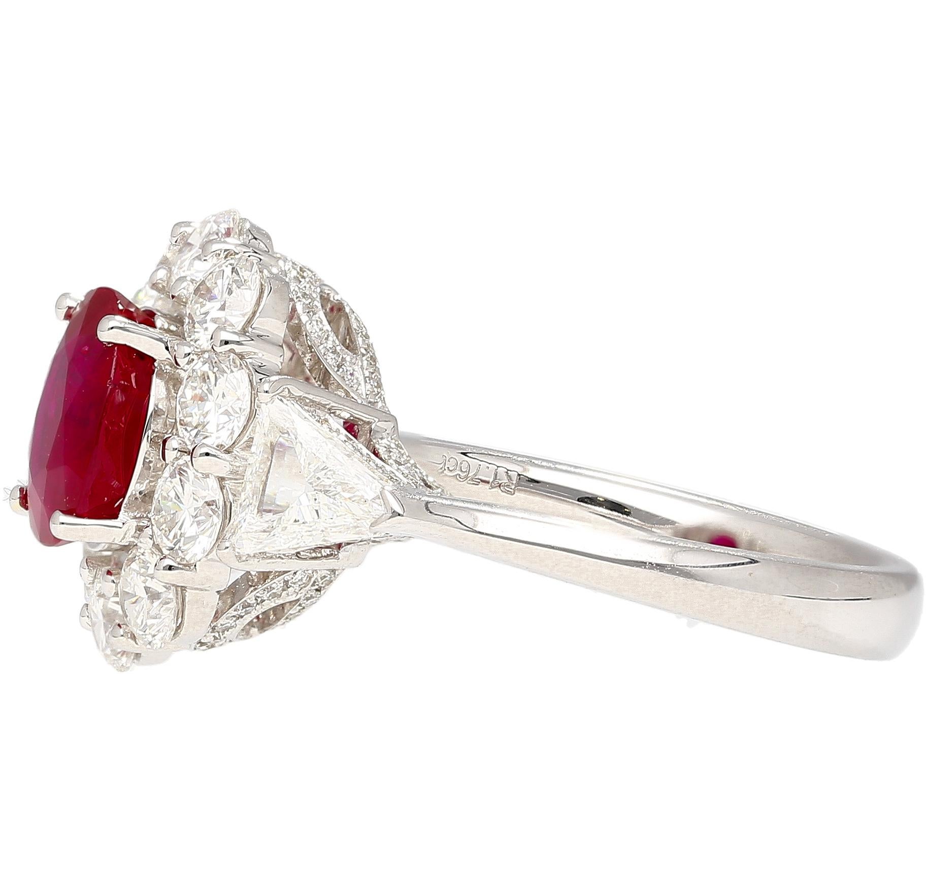 AGL Certified 1.76 Carat Cushion Cut Pigeon's Blood Red No Heat Burma Ruby & Diamond Ring in 18k White Gold. Set with a round cut diamond halo and two trillion cut side stones.

The Ruby is a true gem. Known in the trade as a pigeon's blood red