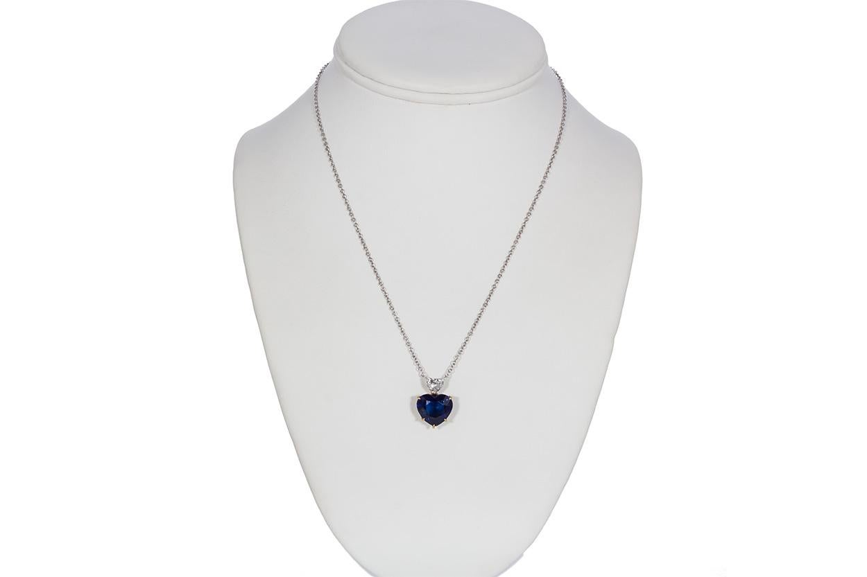 We are pleased to offer this AGL Certified 18k Yellow & White Gold Sabbadini Sapphire & Diamond Heart Pendant. This stunning Sabbadini necklace feature an AGL certified cornflower blue Madagascar heart shaped Sapphire estimated at 10.00cts accented