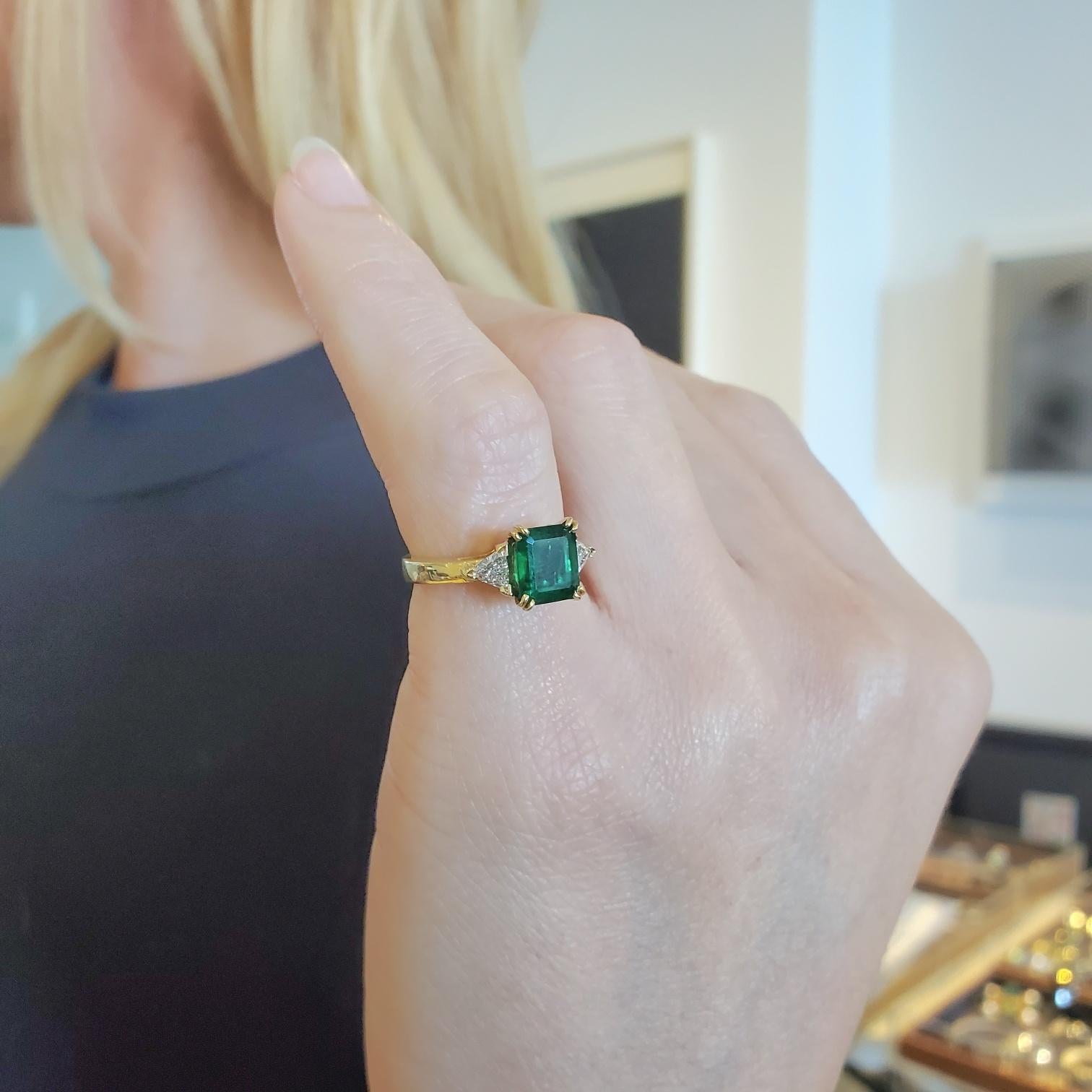AGL certified Gorgeous emerald and diamonds ring.

A modern classic three stones setting ring, crafted in solid 18 karats yellow gold with high polished finish. 

Emerald: Mount in the center in four prong setting, with one rectangular emerald cut