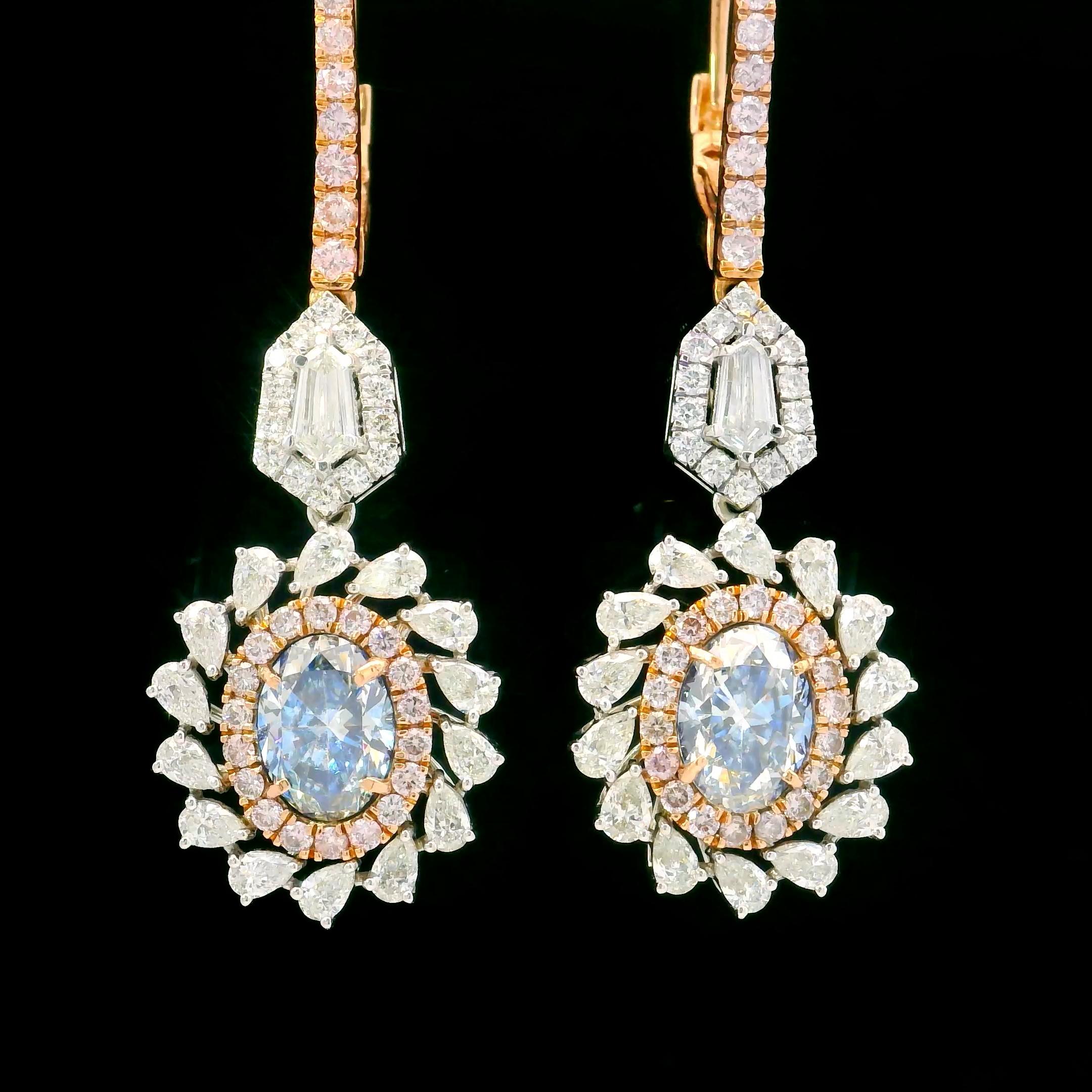 18kt white gold Earring with diamonds
  
  Gold colour & karat: White gold 18kt
  Weight: 8.31 grams
  
  Set with-
  Stone type: Diamonds
  Shape: Round
  Carat: 2.00 (2 Pcs)
  Colour: Fancy Blue
  Clarity: VS
  
  Surrounding Stones: Diamonds
 1)
