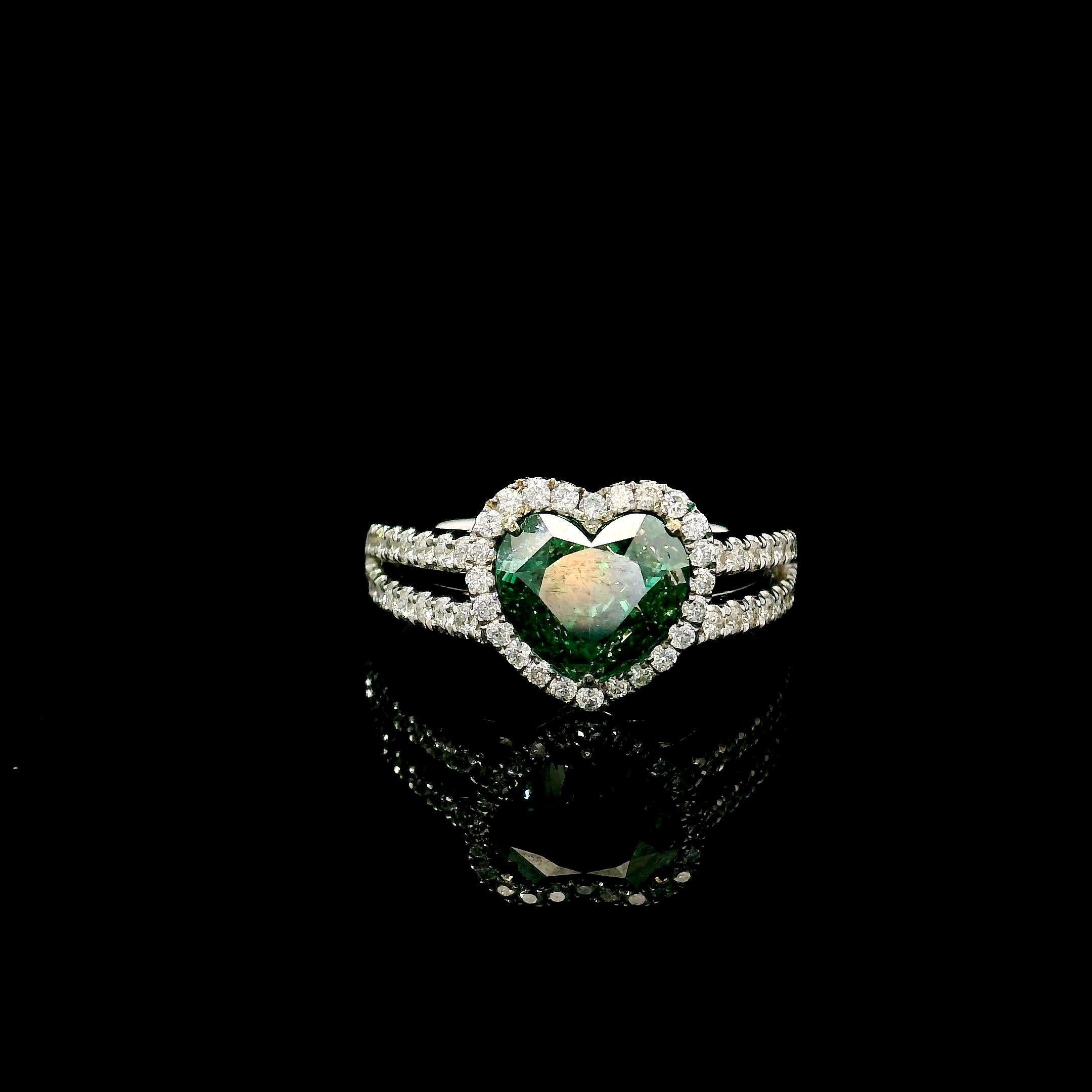 18kt white gold ring with diamonds
  
  Gold colour & karat: White gold 18kt
  Weight: 4.692 grams
  
  Set with-
  Stone type: Diamonds
  Shape: Heart
  Carat: 2.00
  Colour: Fancy Intense Green
  Clarity: VS
  
  Surrounding Stones: Diamonds
 1)