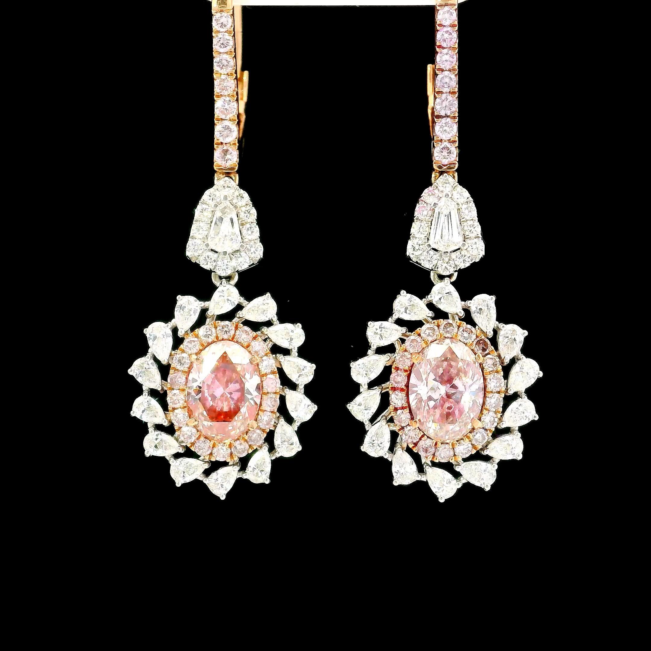 18kt white gold Earring with diamonds
  
  Gold colour & karat: White gold 18kt
  Weight: 8.02 grams
  
  Set with-
  Stone type: Diamonds
  Shape: Oval
  Carat: 2.00 (2 Pcs )
  Colour: Fancy Pink
  Clarity: VS
  
  Surrounding Stones: Diamonds
 1)