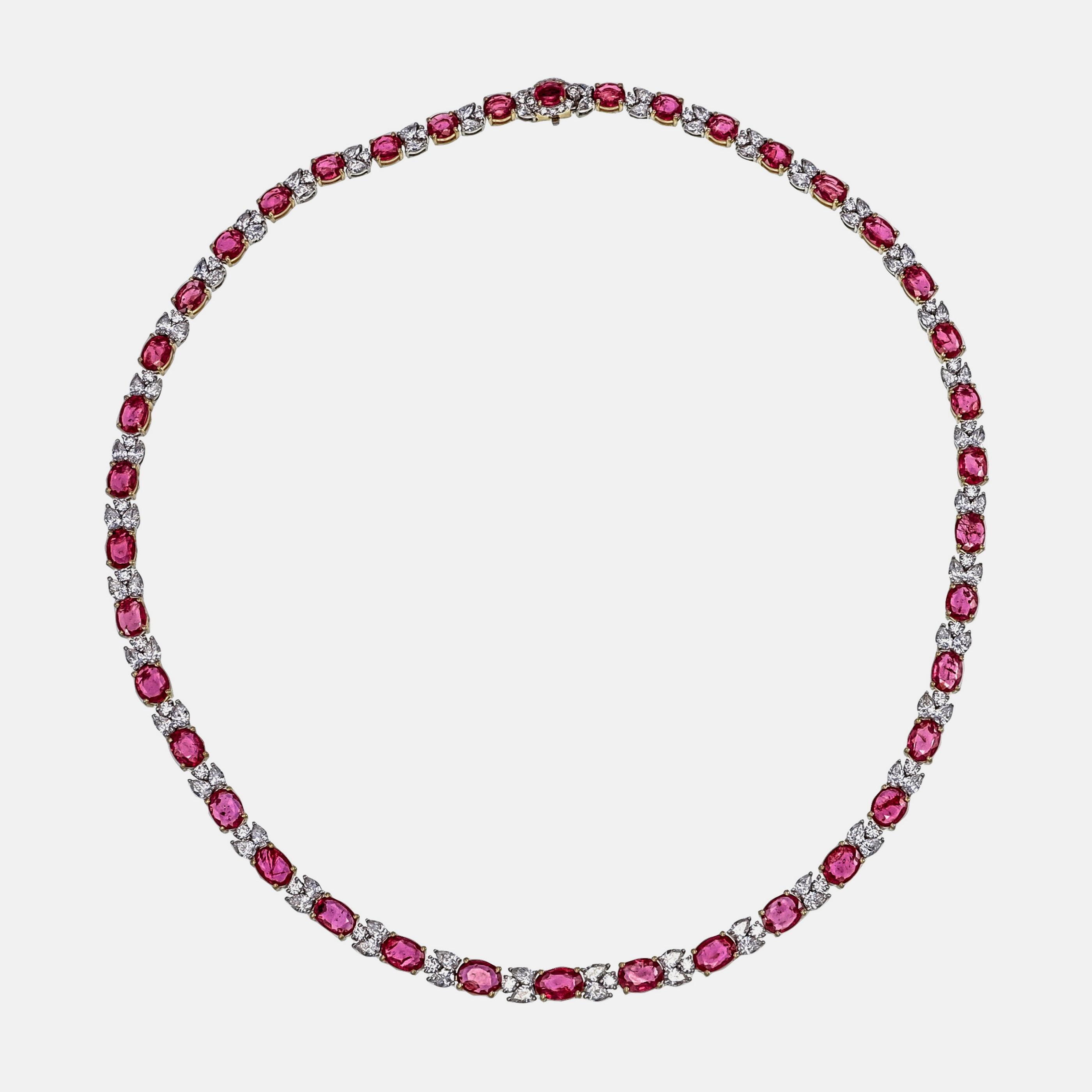 This unique vibrant Mozambique ruby and diamond necklace designed and crafted by Rewa jewels in 18 karat white gold.
The necklace is studded with 40 pieces of Mozambique rubies weighing approximately 20.07 carat in all. 
Surrounded by 80 pieces of