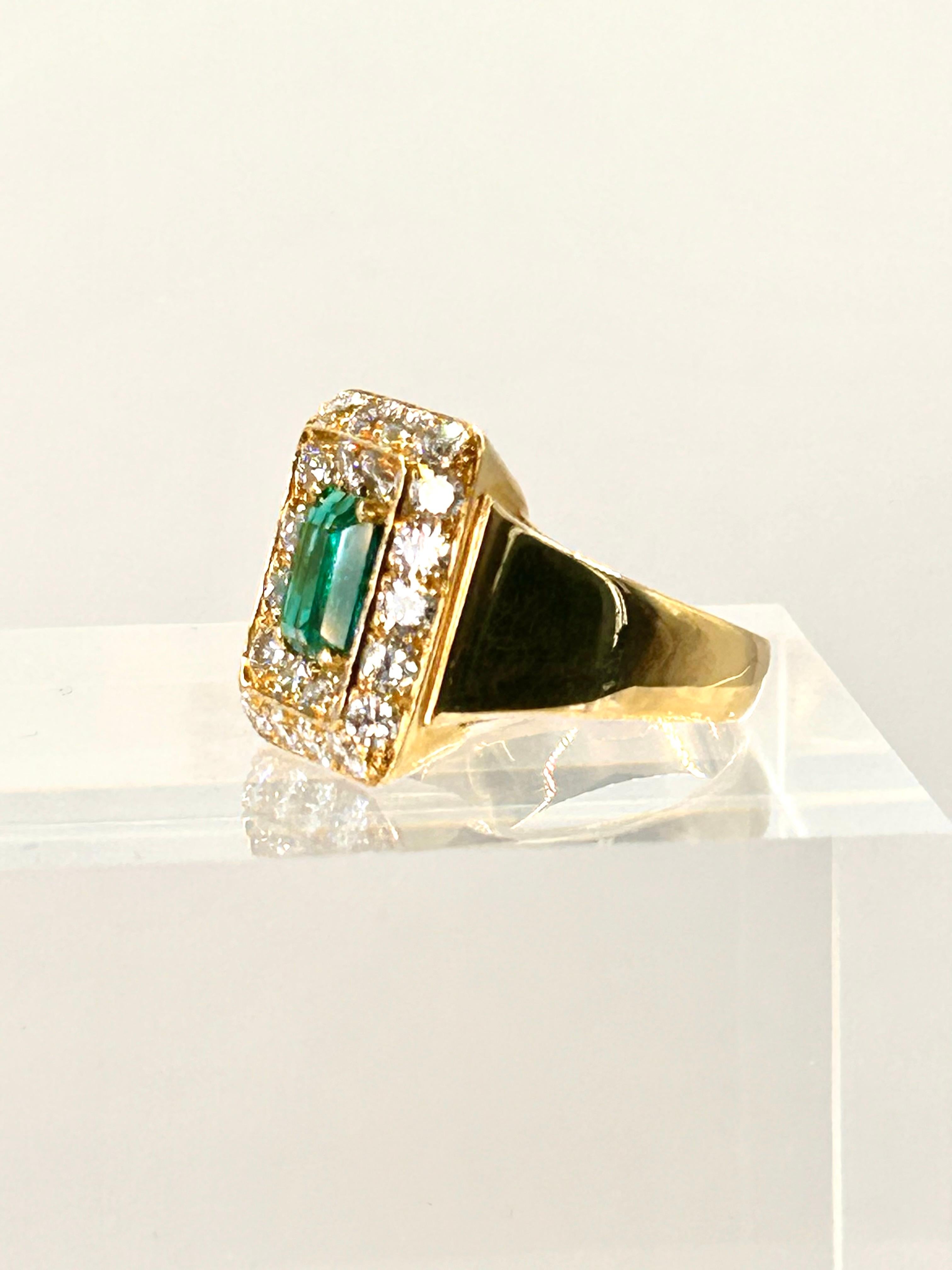 18 Karat Yellow Gold Ring set with an Emerald cut 2.01 Carat Emerald, certified by AGL as Colombian Origin with Minor Traditional Treatment.  The Vivid Green Emerald is surrounded by Round Brilliant Cut Diamonds of 2.50 Carat Total Weight, average