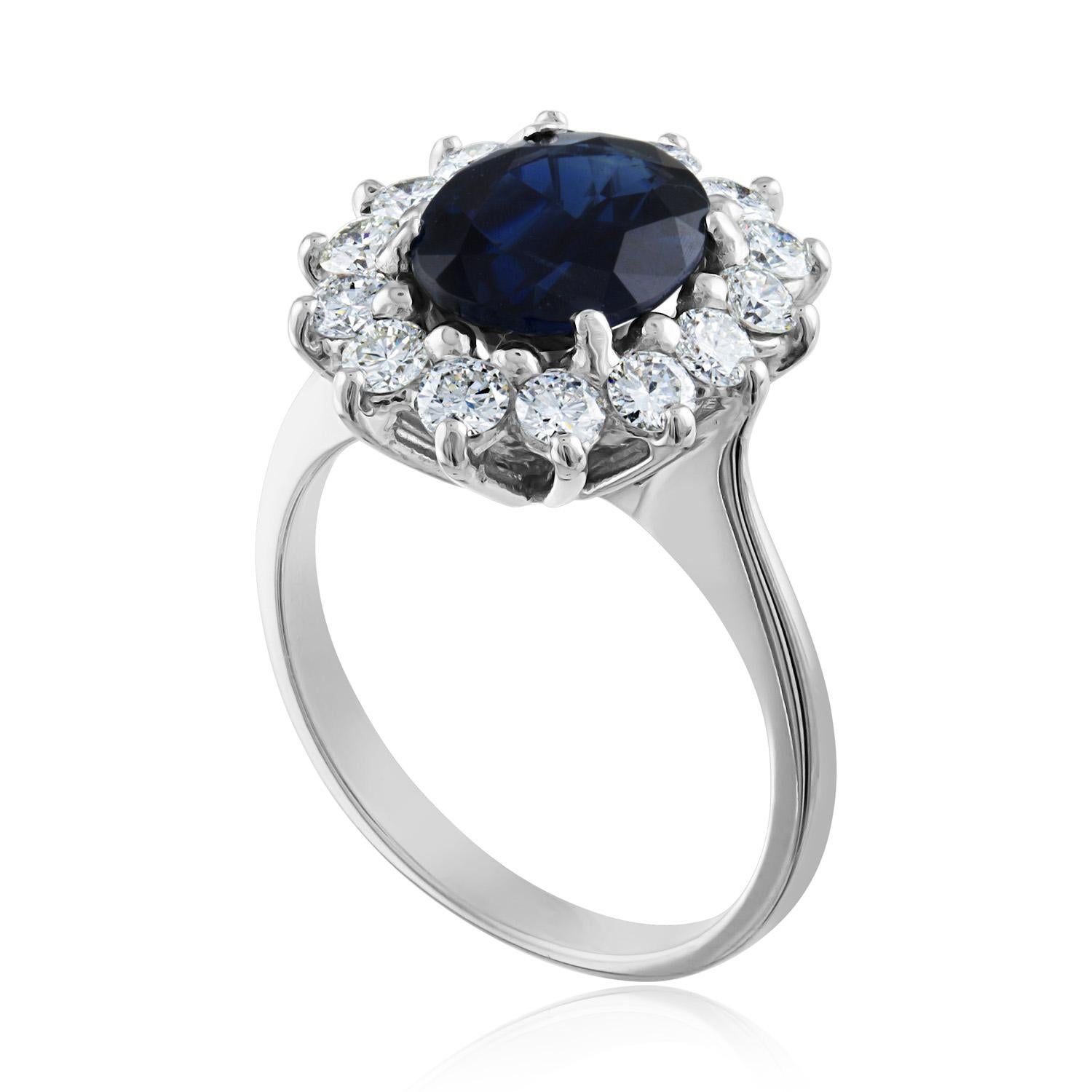 Beautiful Classic Oval Halo Ring.
The ring is 14K White Gold.
The center stone is an oval shaped 2.05 Carat Blue Sapphire.
The Sapphire is certified by AGL, NO HEAT.
The ring has 0.70 Carats in Diamonds F/G VS.
The ring is a size 4.75, sizable.
The