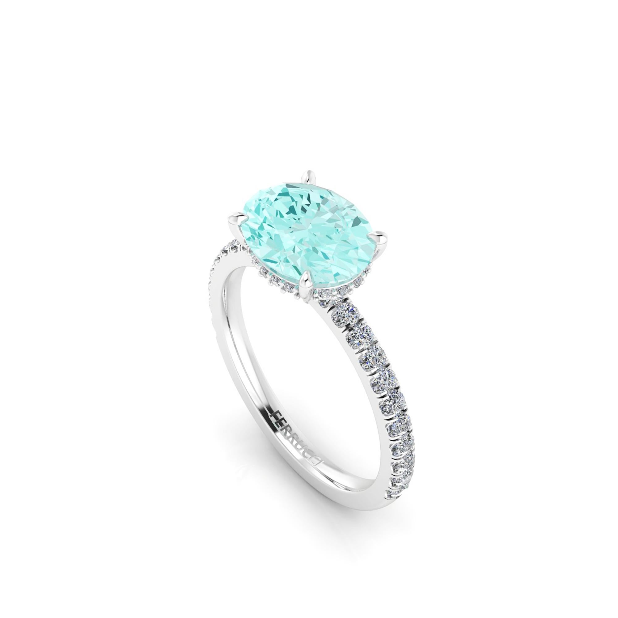 AGL Certified 2.11 carat Paraiba tourmaline, hand cut in Oval cut shape, a rare gem, conceived in a hand made Platinum ring, set Horizontally and
adorned with a shower of white diamonds, hand set on almost every surface to give the maximum light