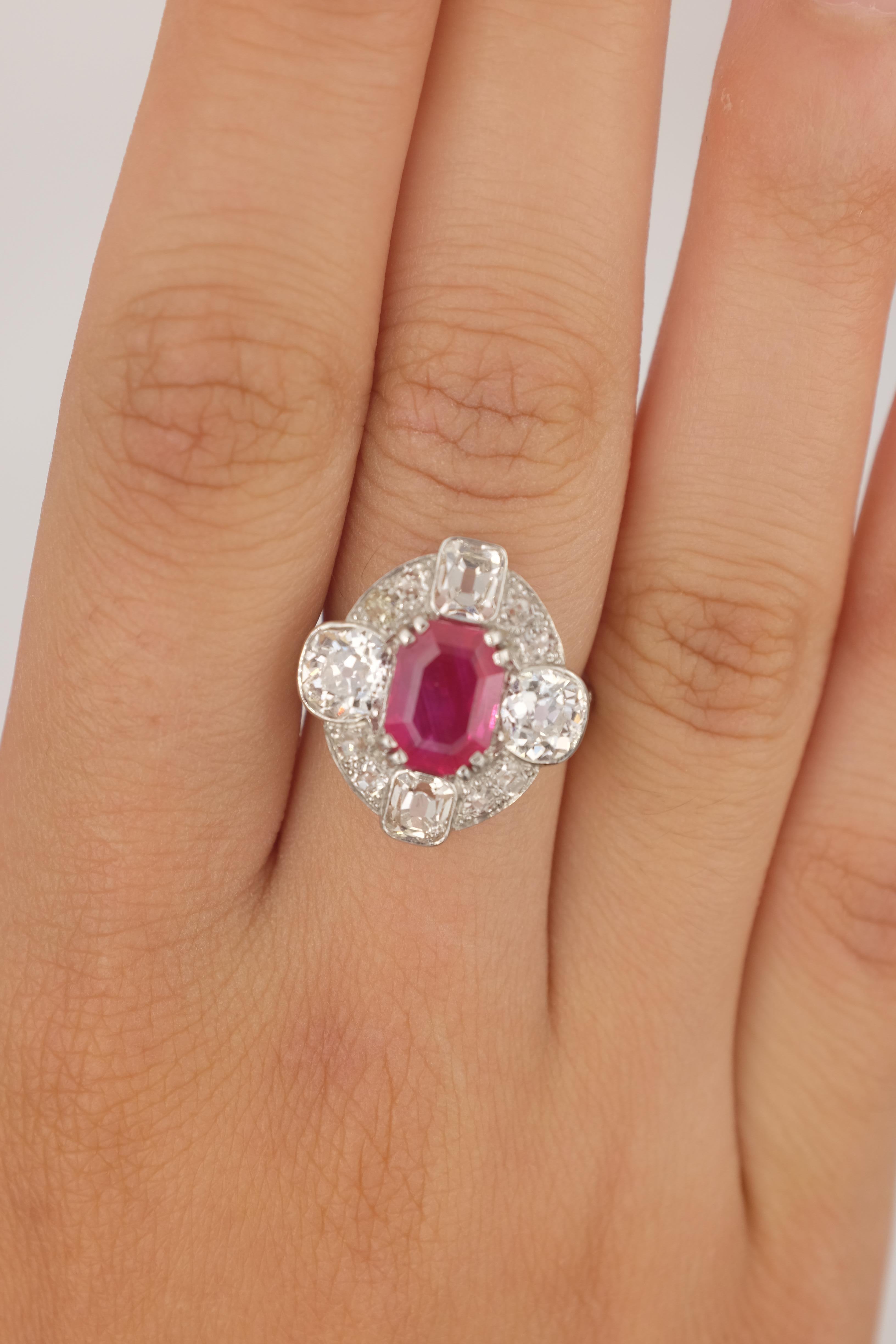 2.24 carat no heat Burmese Ruby mounted on a platinum ring surrounded by estimated 2.5 carats of old-cut diamonds on an art-deco ring. Ruby is certified by AGL. 