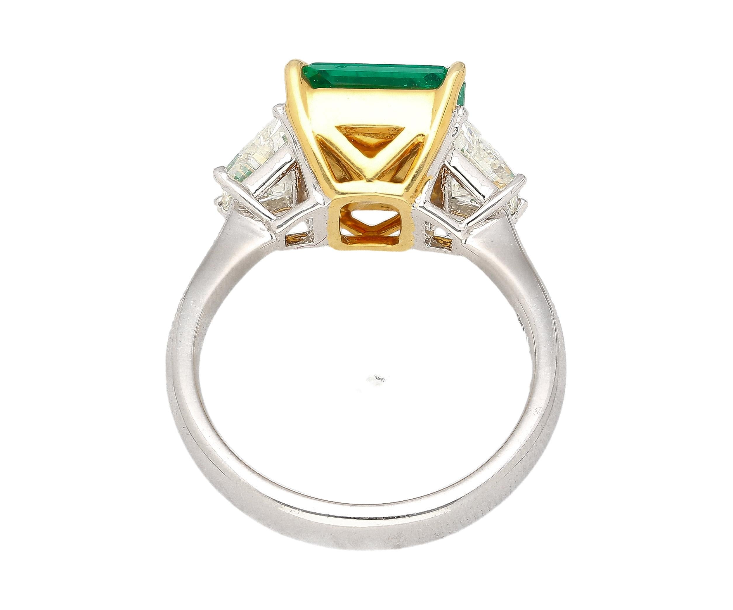 Natural AGL Certified No Oil Emerald & Diamond Detailing Three-Stone Engagement Ring.

This engagement ring features a stunning, vivid green emerald center stone with a carat weight of 2.44. This stone is extremely rare, bearing excellent luster,