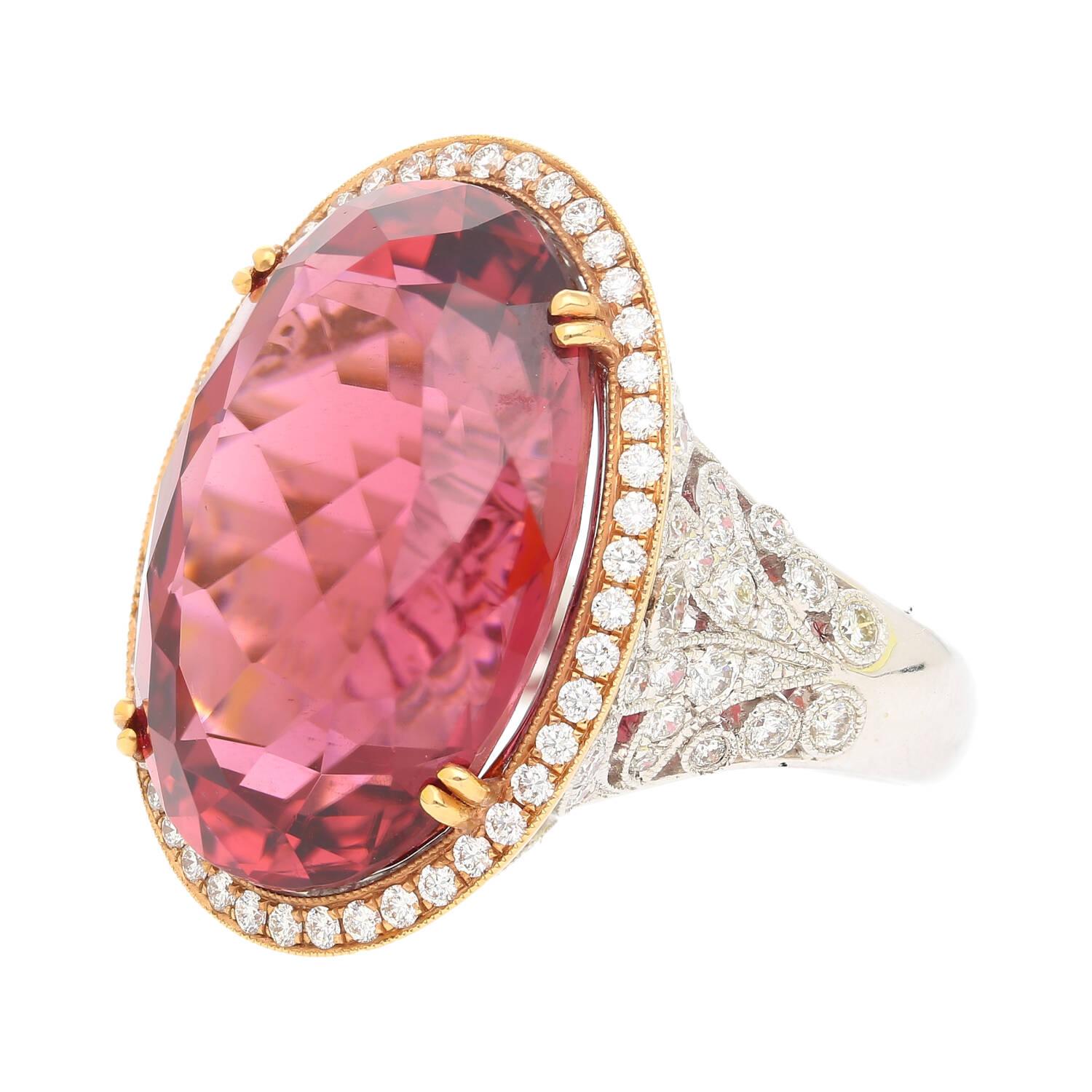 AGL Certified 28.29 Carat No Heat Pink Tourmaline And Round Cut Diamond Halo in Floral 18K White Gold Ring Shank.

The center stone is an impressive 28.29-carat pink tourmaline, oval cut with maximum brilliance and bearing no heat treatment,