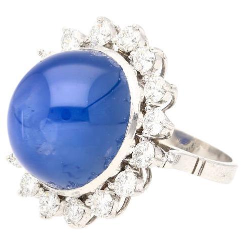 Natural 30 Carat no Heat Ceylon Blue Star Sapphire & Diamond Ring In Platinum

This unheated star sapphire ring boasts a 30 carat natural blue sapphire center stone with cabochon-oval-cut and a total weight of 30 carats. Originating from Ceylon, Sri