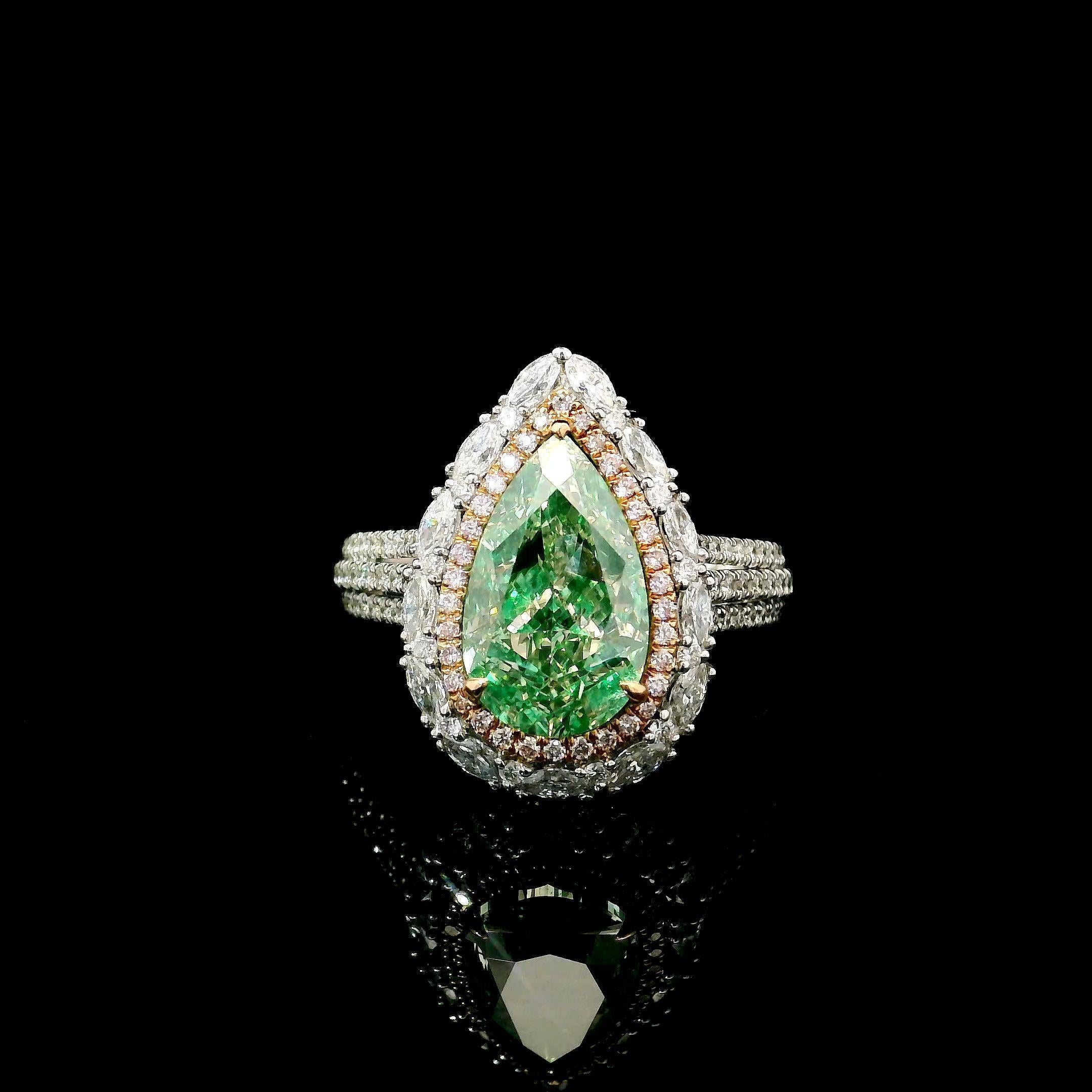 18kt white gold ring with diamonds
  
  Gold colour & karat: White gold 18kt
  Weight: 6.598 grams
  
  Set with-
  Stone type: Diamonds
  Shape: Pear
  Carat: 3.00 ct
  Colour: Fancy Green
  Clarity: VVS
  
  Surrounding Stones: Diamonds
 1) White