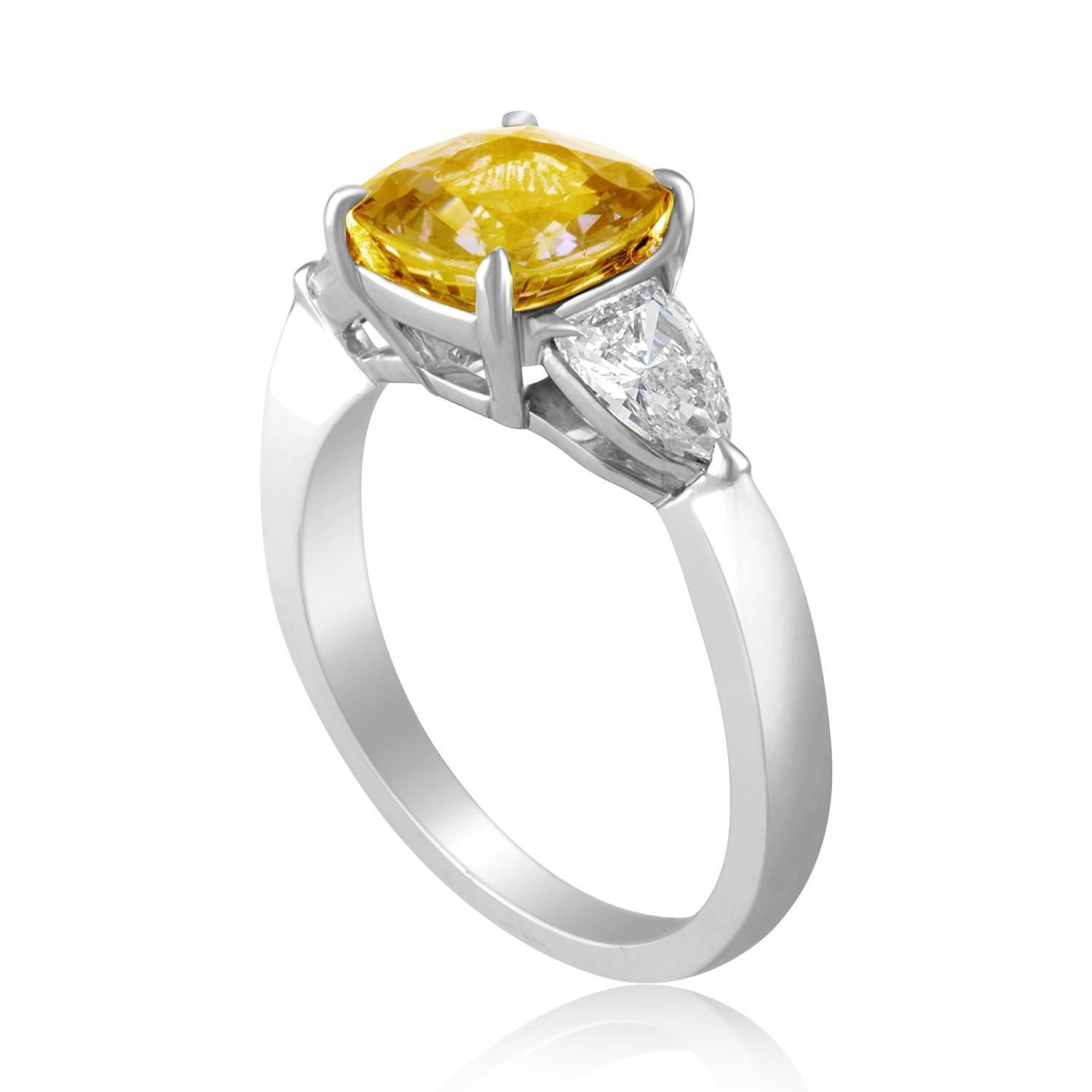 Beautiful 3 Stone Ring
The ring is 18K White Gold
The Center Stone is an Orangy Yellow Cushion Sapphire 3.16 Carats
The Sapphire is AGL Certified Heated
There are 0.78 Carats in Diamonds G/H VS
The ring is a size 6.5, sizable
The ring weighs 4.5