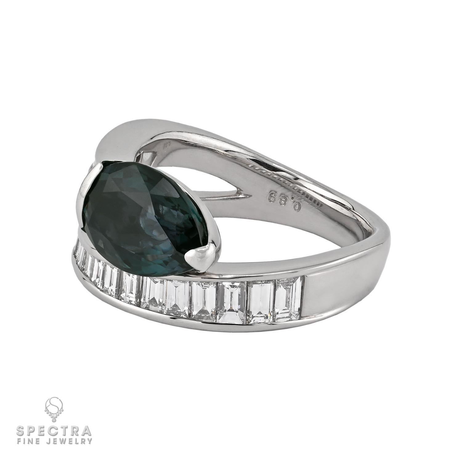 This stunning cocktail ring captivates with a mesmerizing 3.36-carat pear-shaped Alexandrite from India, celebrated for its remarkable color-changing properties. Unheated and certified by AGL, this rare gemstone radiates an enchanting blend of hues,