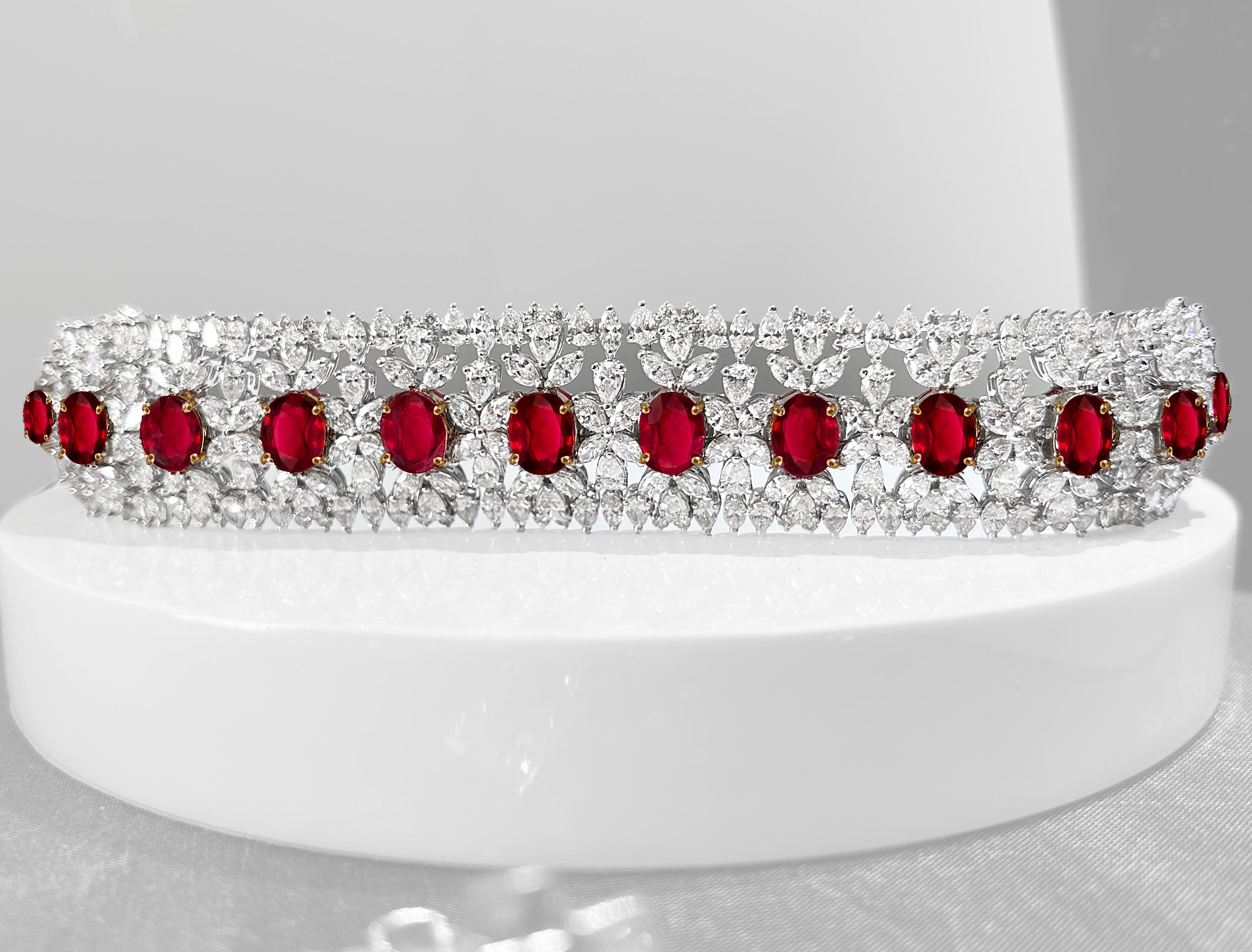 One-of-a-kind, AGL-certified, Burmese ruby and diamond wide tennis bracelet crafted in 18-karat white and 18-karat yellow gold.
The 13 oval-shaped Burma rubies are AGL-certified and measure in size from 10.00 x 7.70 x 3.16 mm to 8.32 x 6.82 x