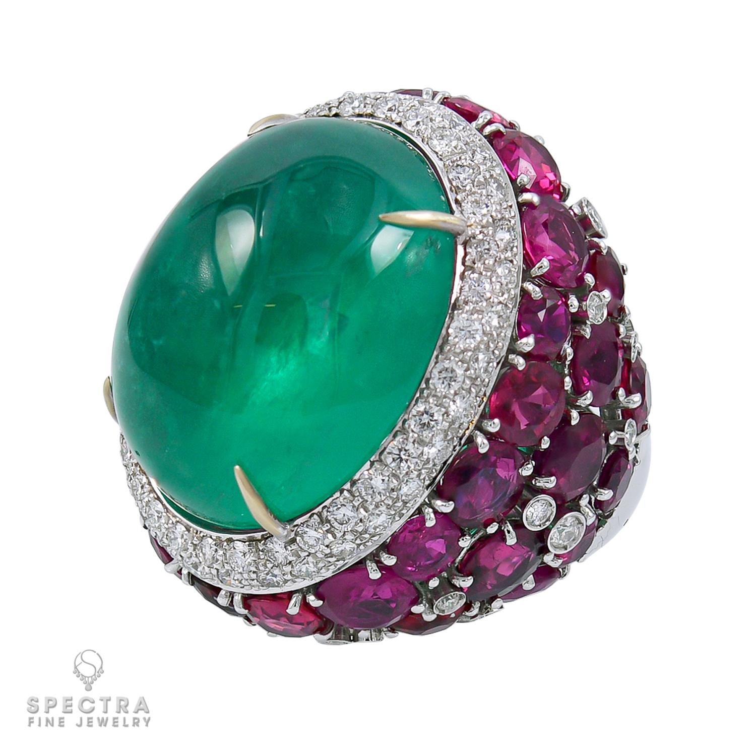 Immerse yourself in the grandeur of nature's bounty with this spectacular cocktail ring, a triumph of craftsmanship and elegance. At its heart lies a magnificent 37-carat cabochon green emerald, its verdant allure commanding attention and