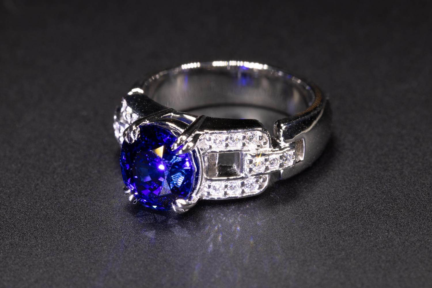 This is a beautiful Blue Ceylon Natural untreated 4.032 Sapphire ring set in a custom made platinum setting. The sapphire is accented by diamond accents and is set in a classic platinum setting. This is a timeless piece of jewelry made by Martoni &