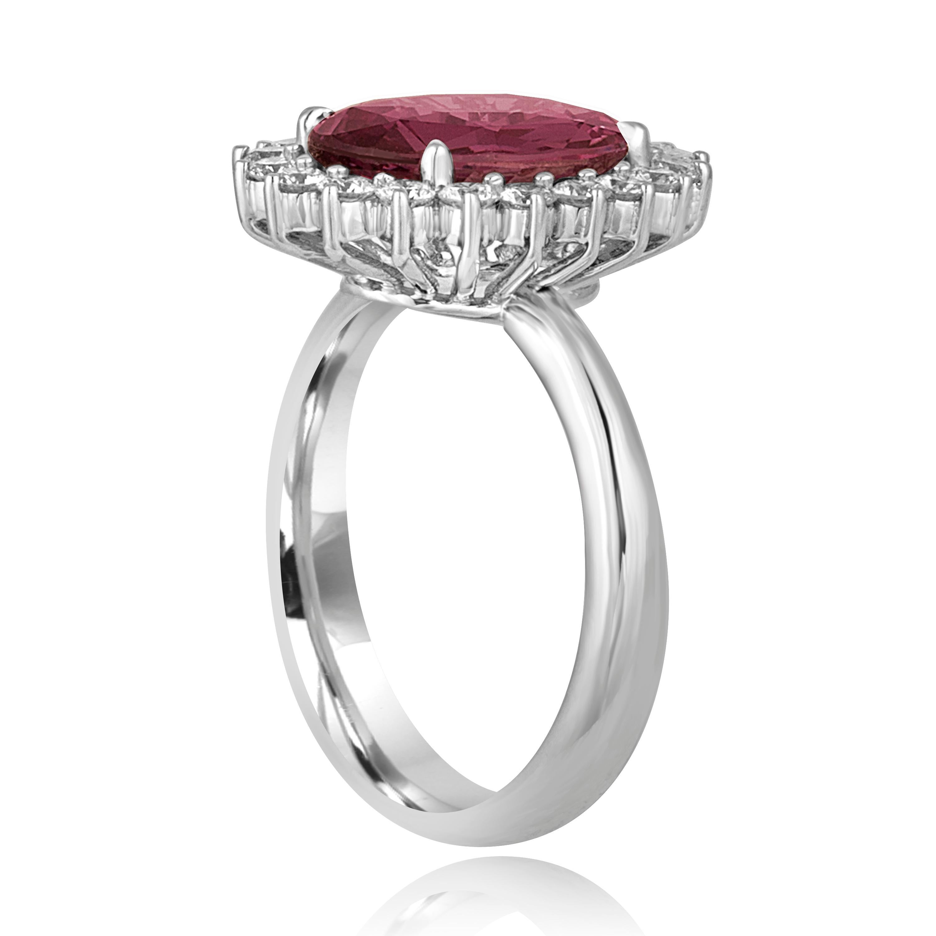 Beautiful Oval Halo Ring.
The ring is 18K White Gold.
The ring has 0.61 Carats in diamonds F/G VS.
The center stone is an oval shaped 4.06 Carat Pink Sapphire.
The Sapphire is heated and is certified by AGL. 
The top of the ring measures 11/16